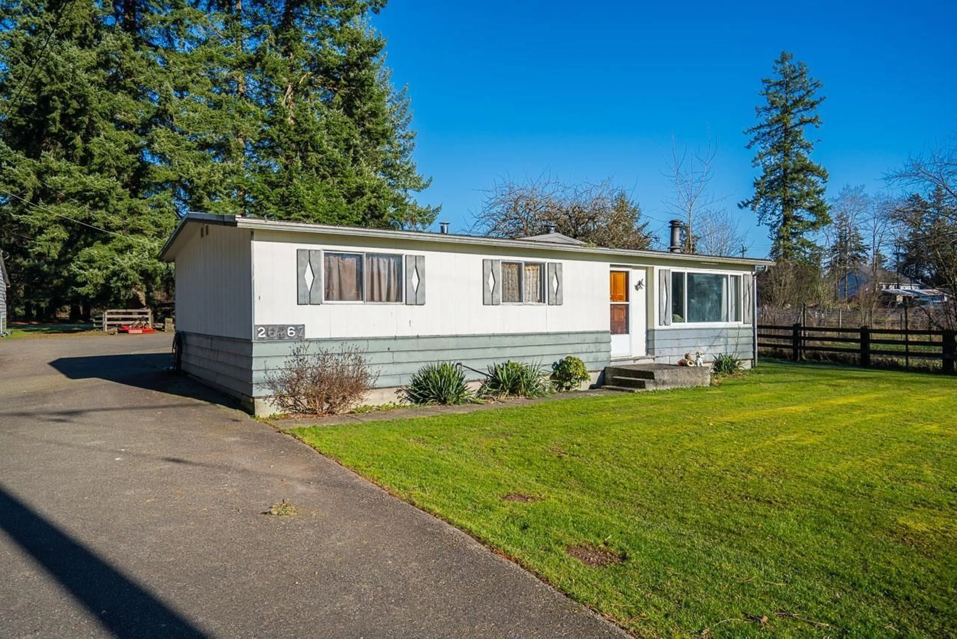 Home with vinyl exterior material, street for 26267 64 AVENUE, Langley British Columbia V4W1M3