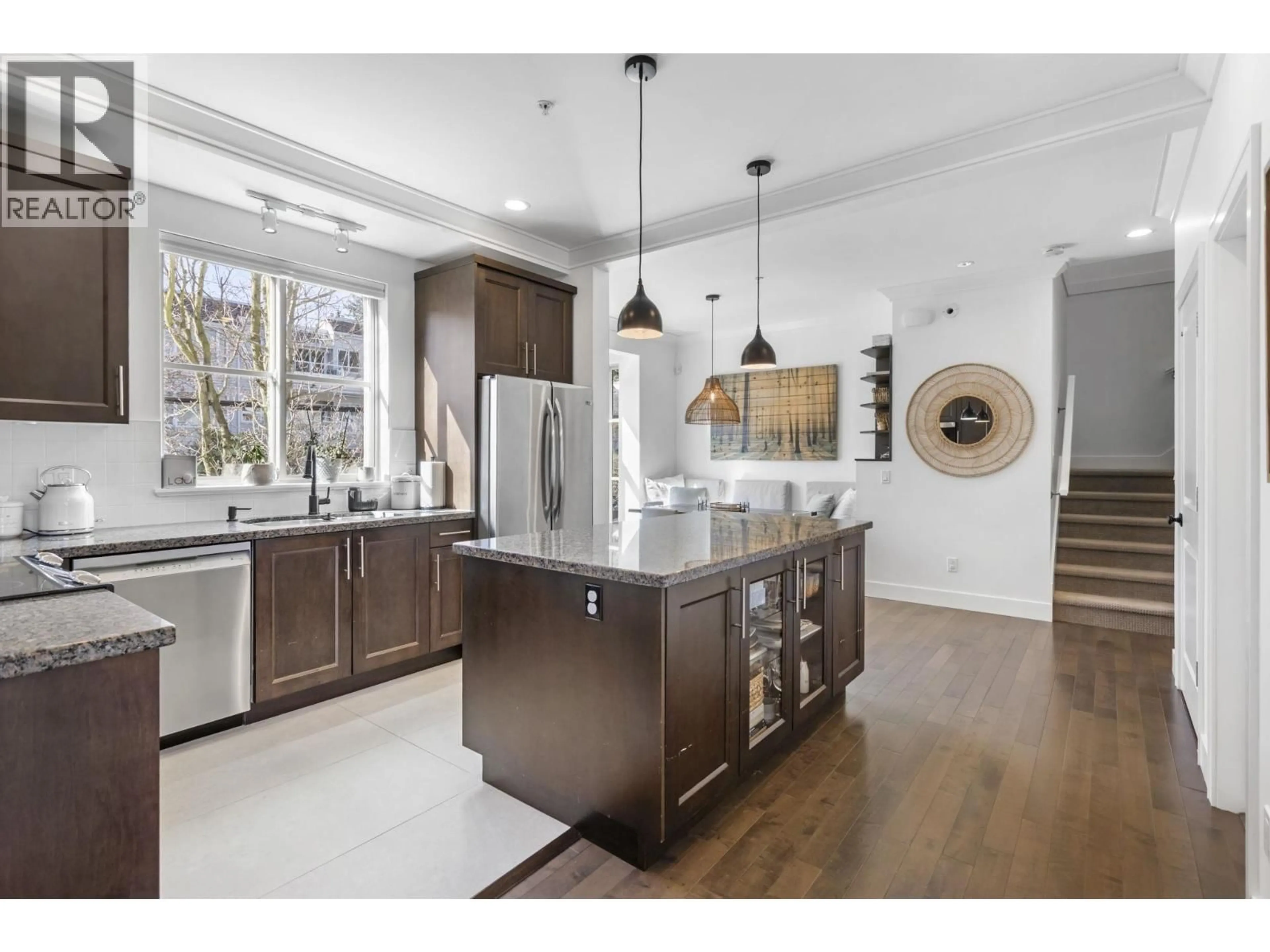 Open concept kitchen, wood/laminate floor for 8 - 3025 BAIRD ROAD, North Vancouver British Columbia V7K2G5