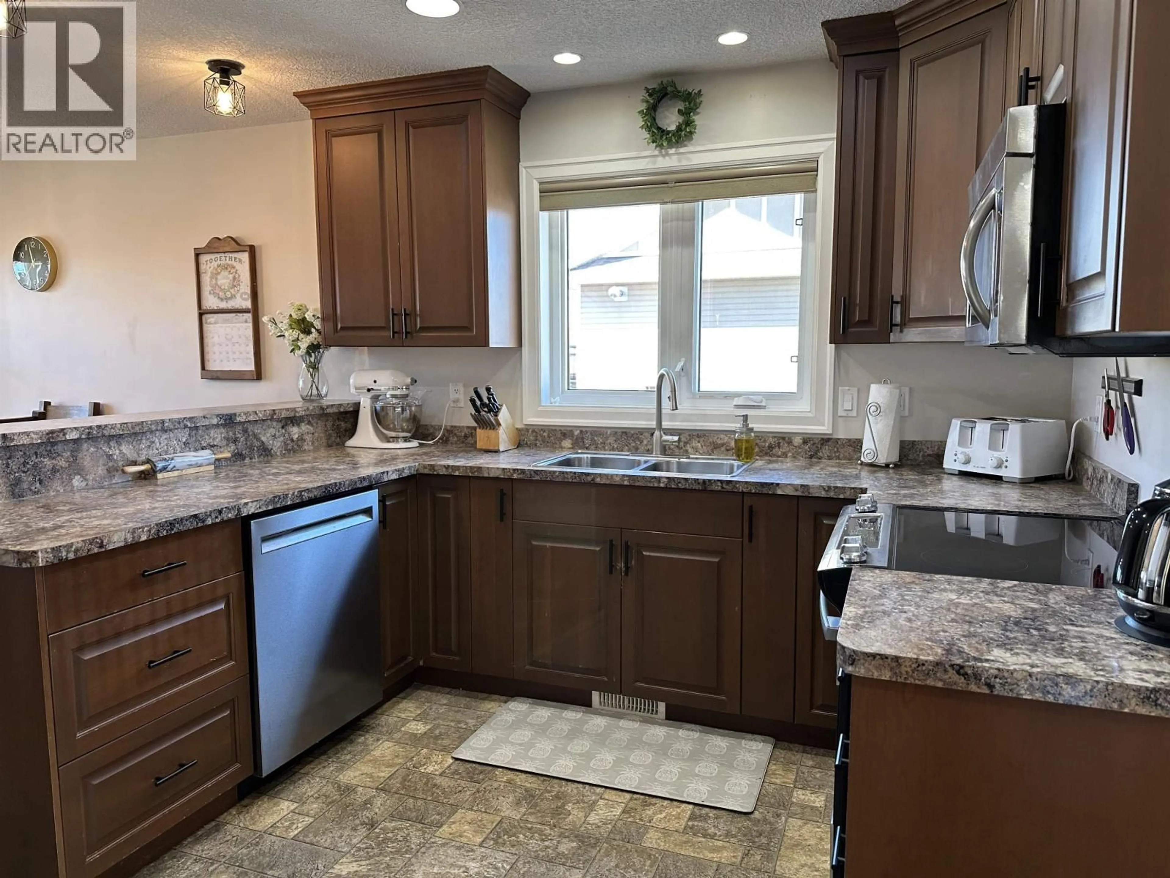 Open concept kitchen, ceramic/tile floor for 8804 118A AVENUE, Fort St. John British Columbia V1J0H8