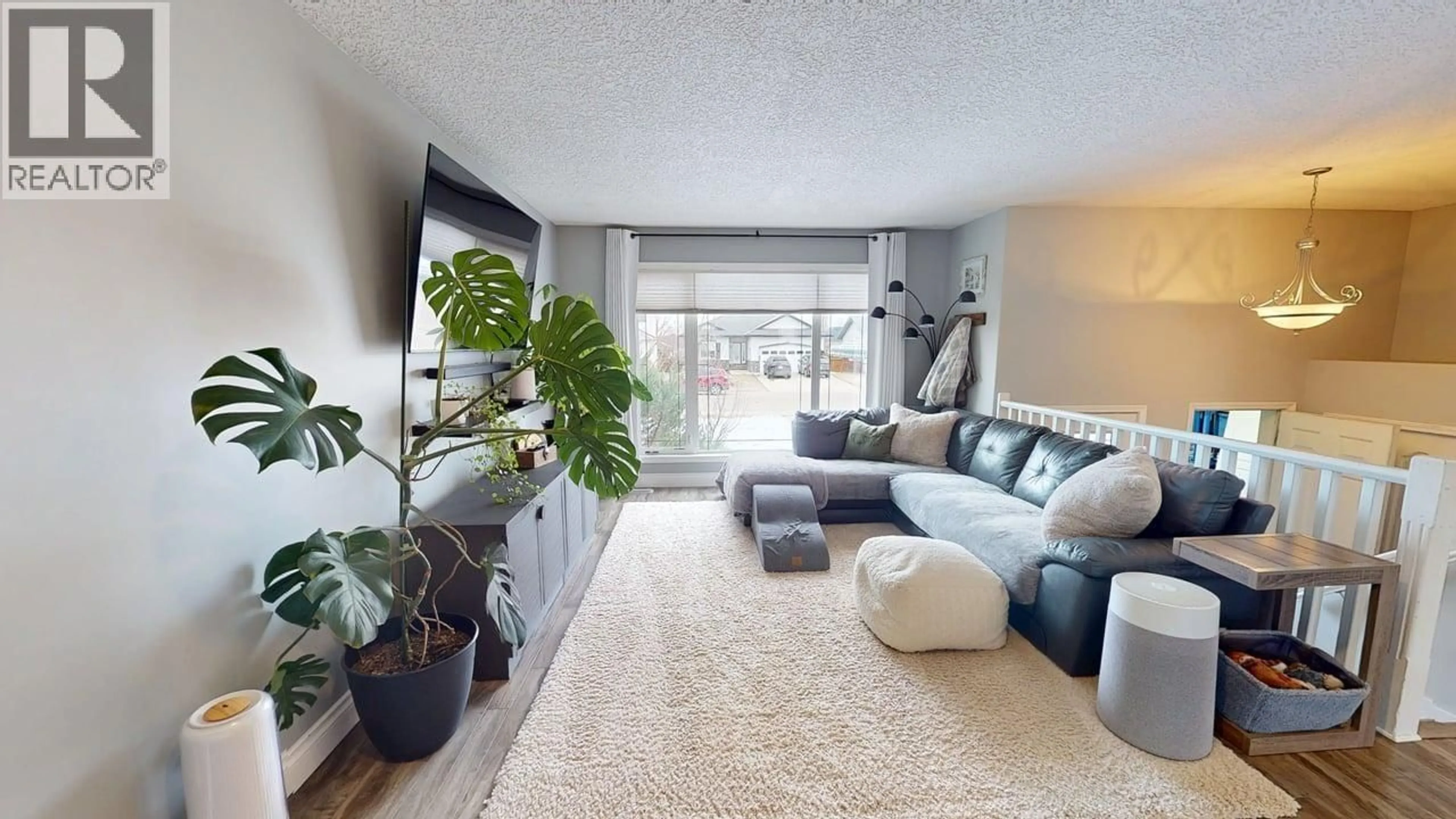 Living room with furniture, carpet floor for 9807 114A AVENUE, Fort St. John British Columbia V1J7B7