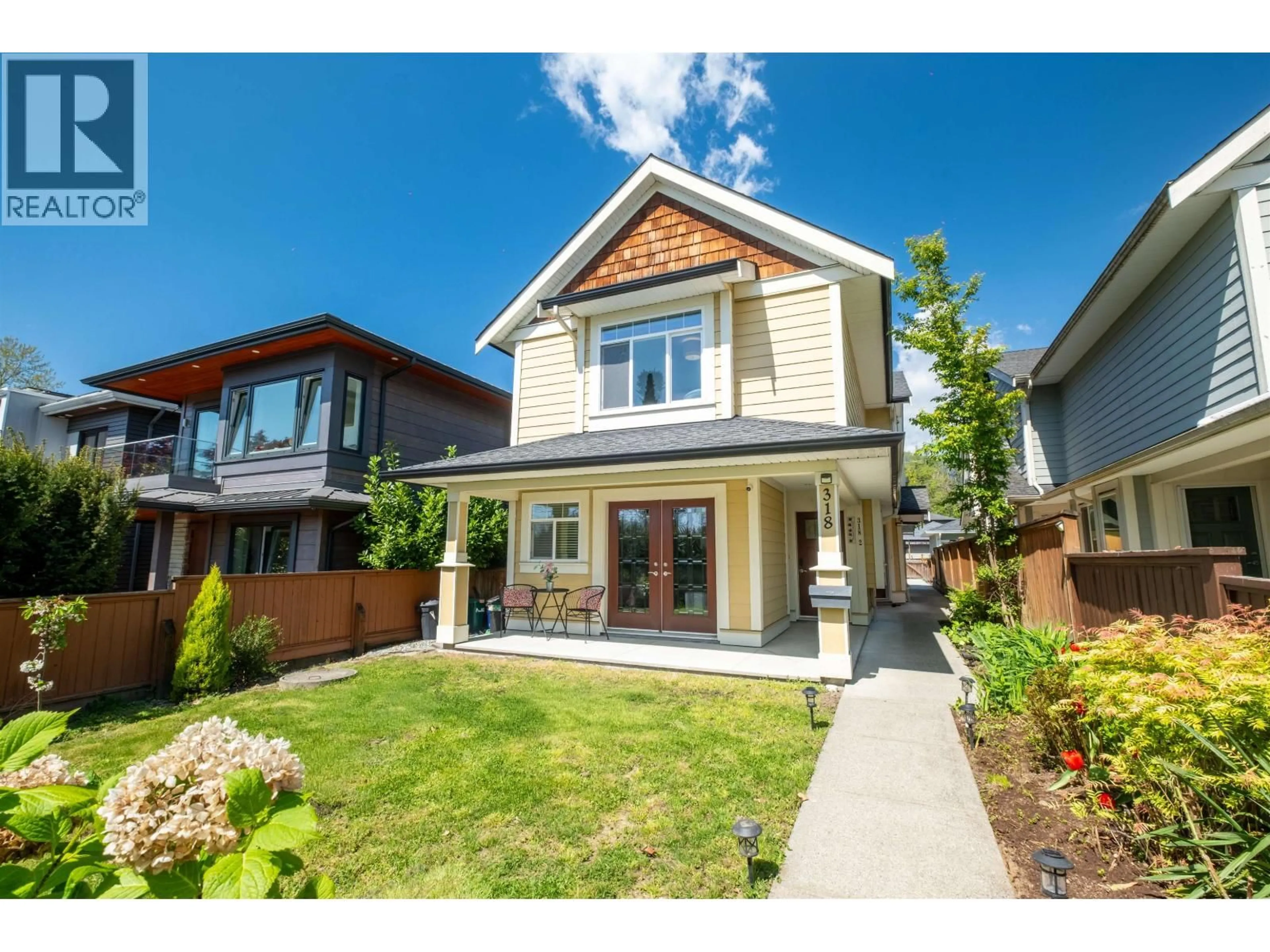 Home with vinyl exterior material, street for 318 18TH STREET, North Vancouver British Columbia V7M1W9