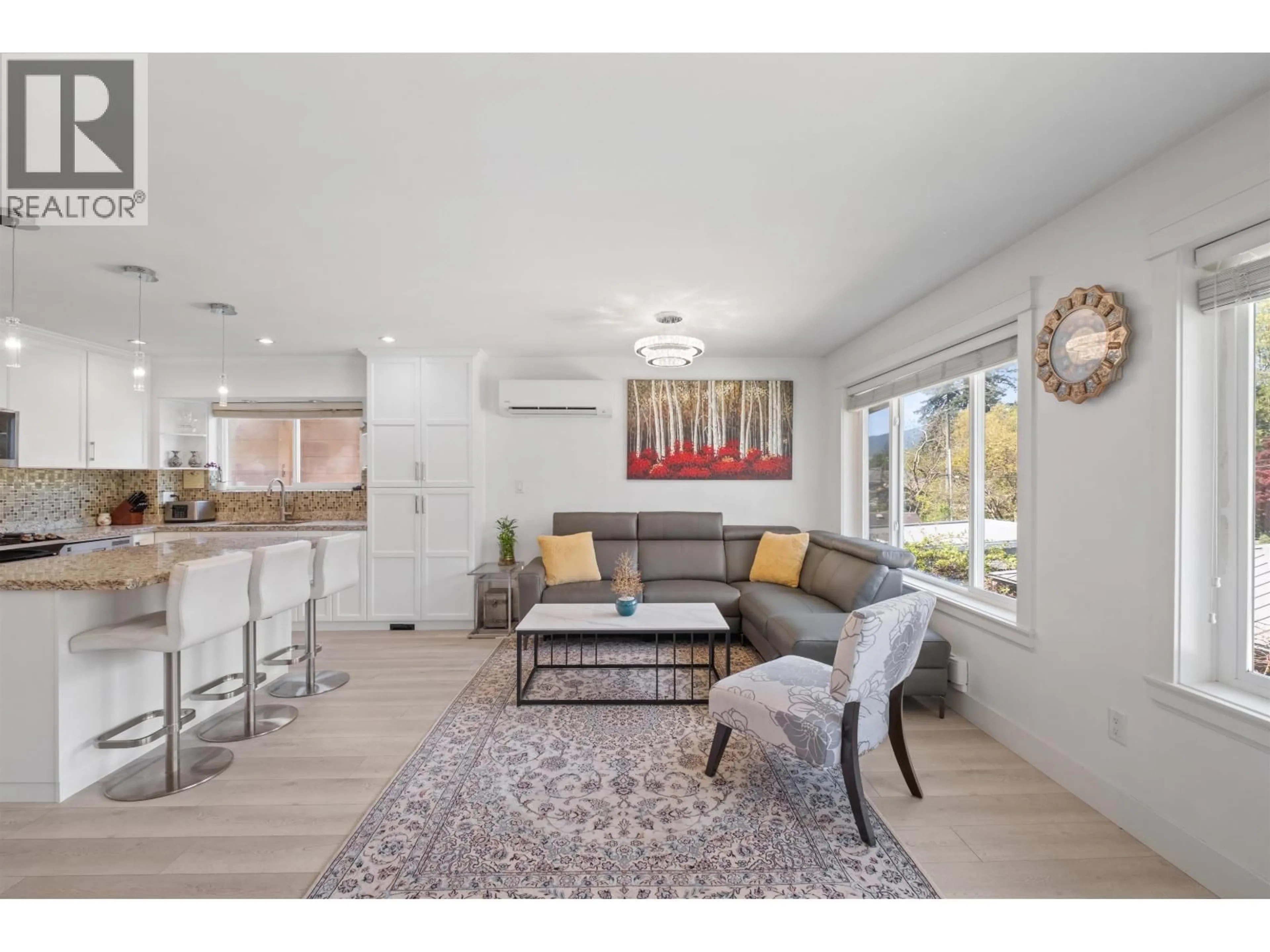 Living room with furniture, wood/laminate floor for 318 18TH STREET, North Vancouver British Columbia V7M1W9