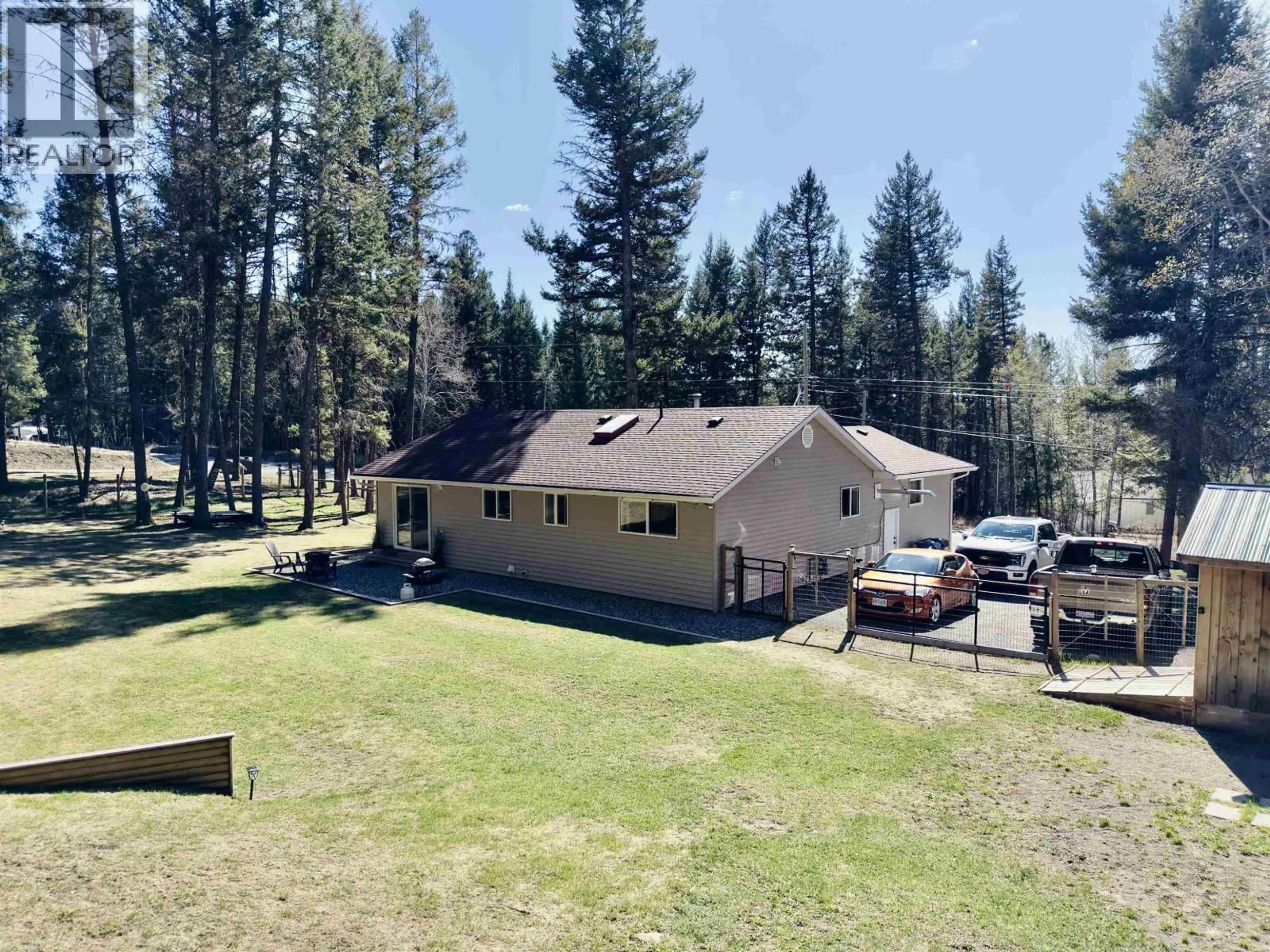 A pic from outside/outdoor area/front of a property/back of a property/a pic from drone, unknown for 4975 GLOINNZUN DRIVE, 108 Mile Ranch British Columbia V0K2Z0