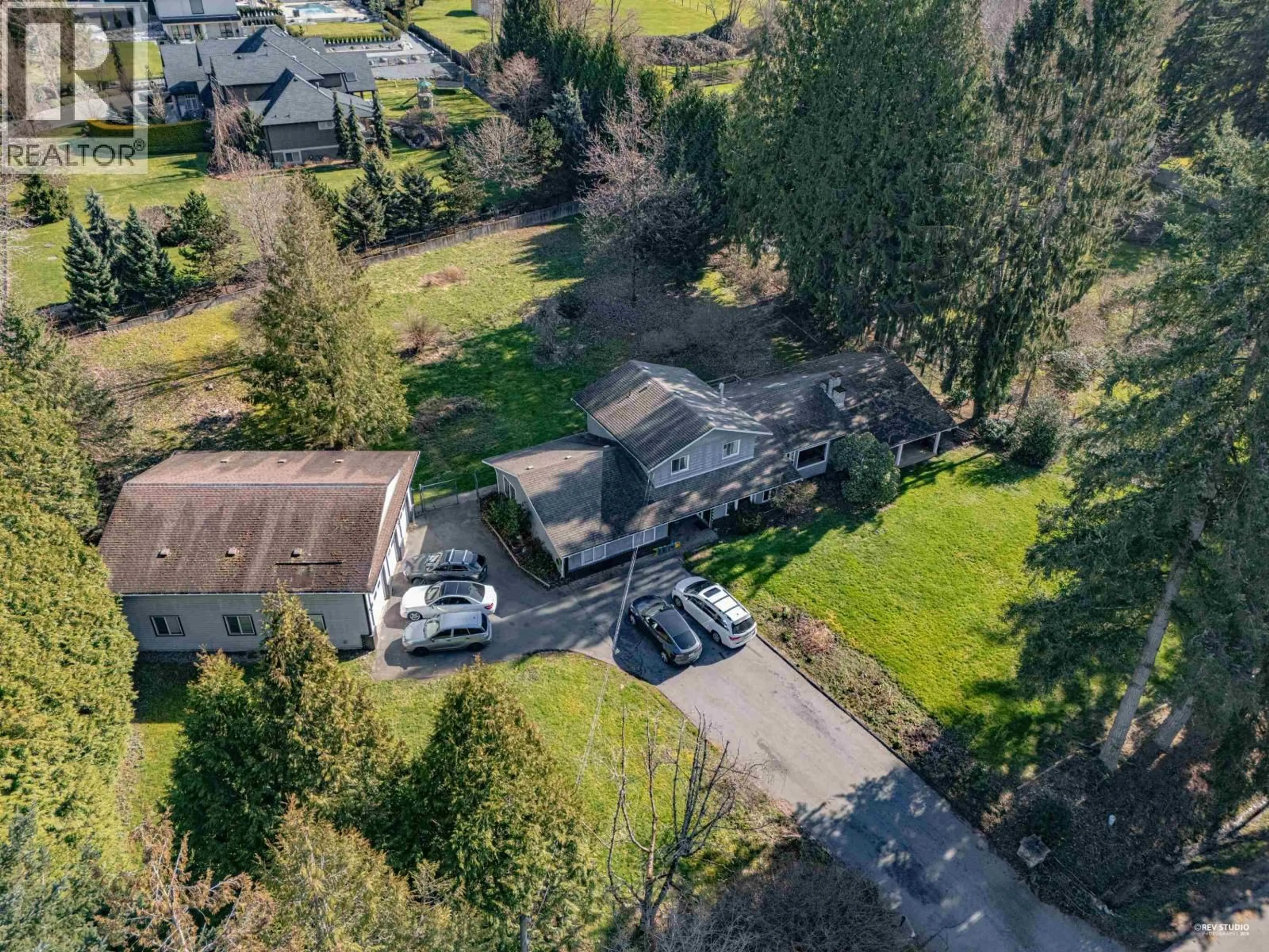 A pic from outside/outdoor area/front of a property/back of a property/a pic from drone, street for 12580 243 STREET, Maple Ridge British Columbia V2W1C4