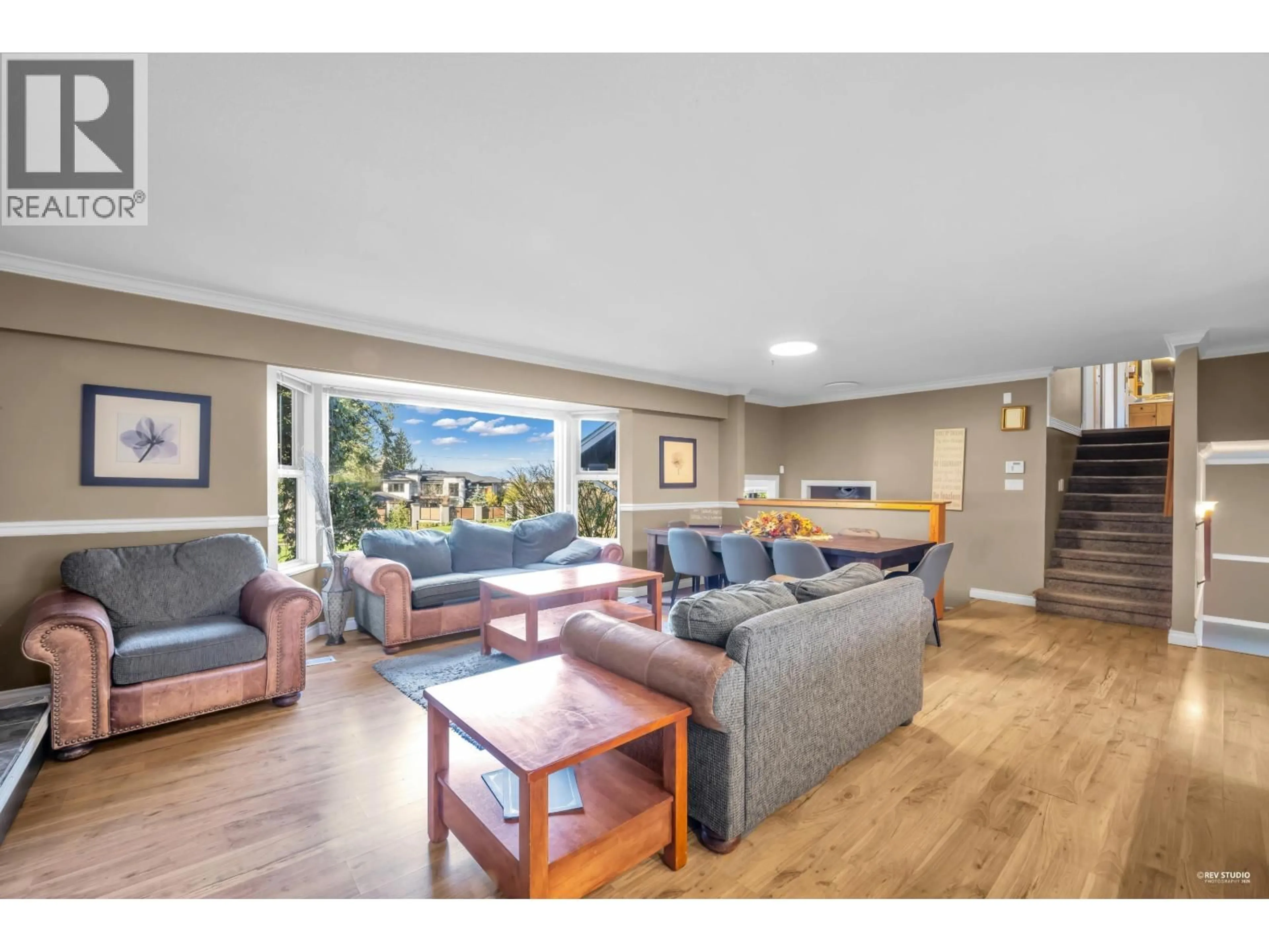 Living room with furniture, wood/laminate floor for 12580 243 STREET, Maple Ridge British Columbia V2W1C4