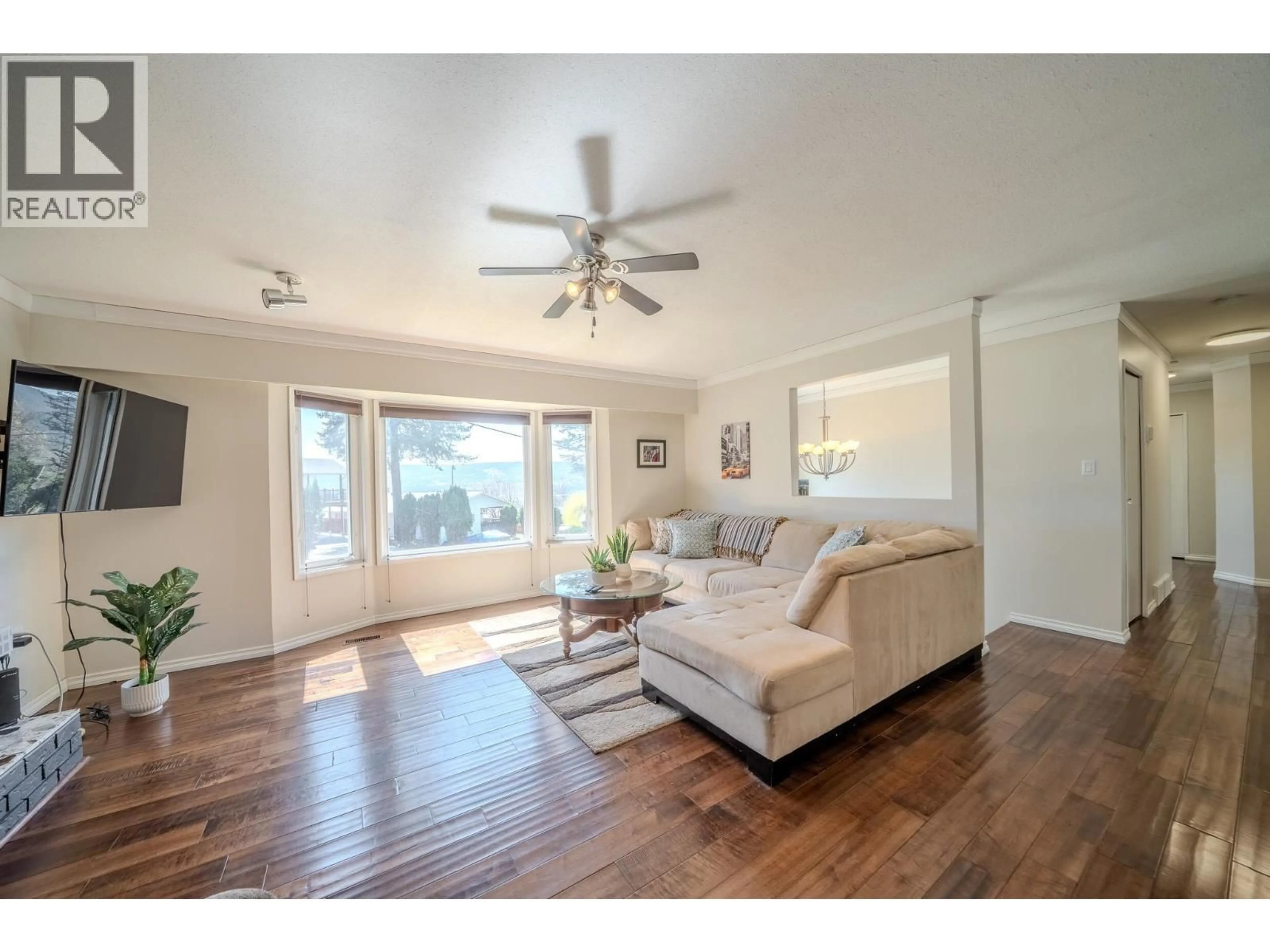 Living room with furniture, wood/laminate floor for 1215 RESKER PLACE, Williams Lake British Columbia V2G4H9