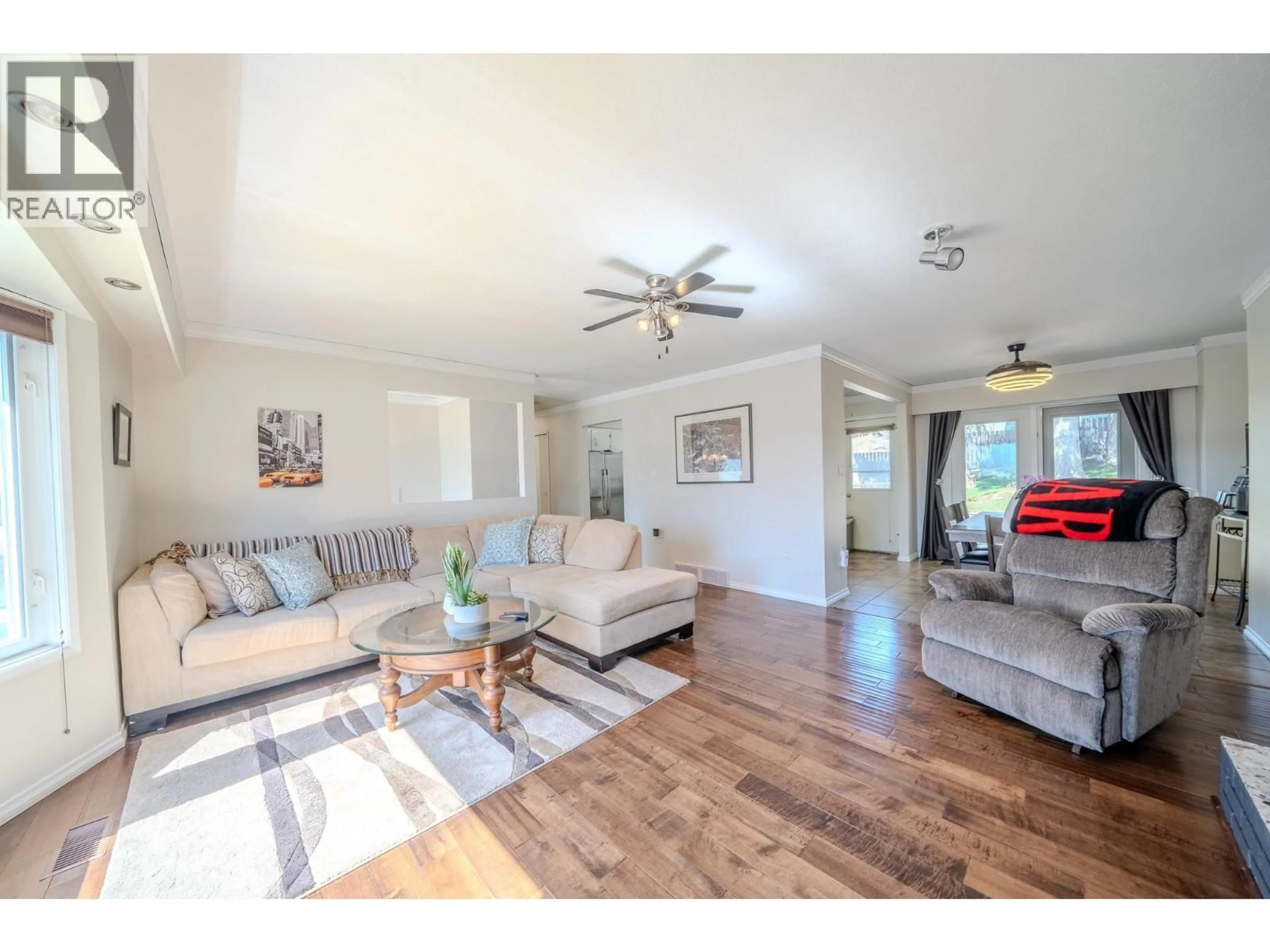 Living room with furniture, wood/laminate floor for 1215 RESKER PLACE, Williams Lake British Columbia V2G4H9