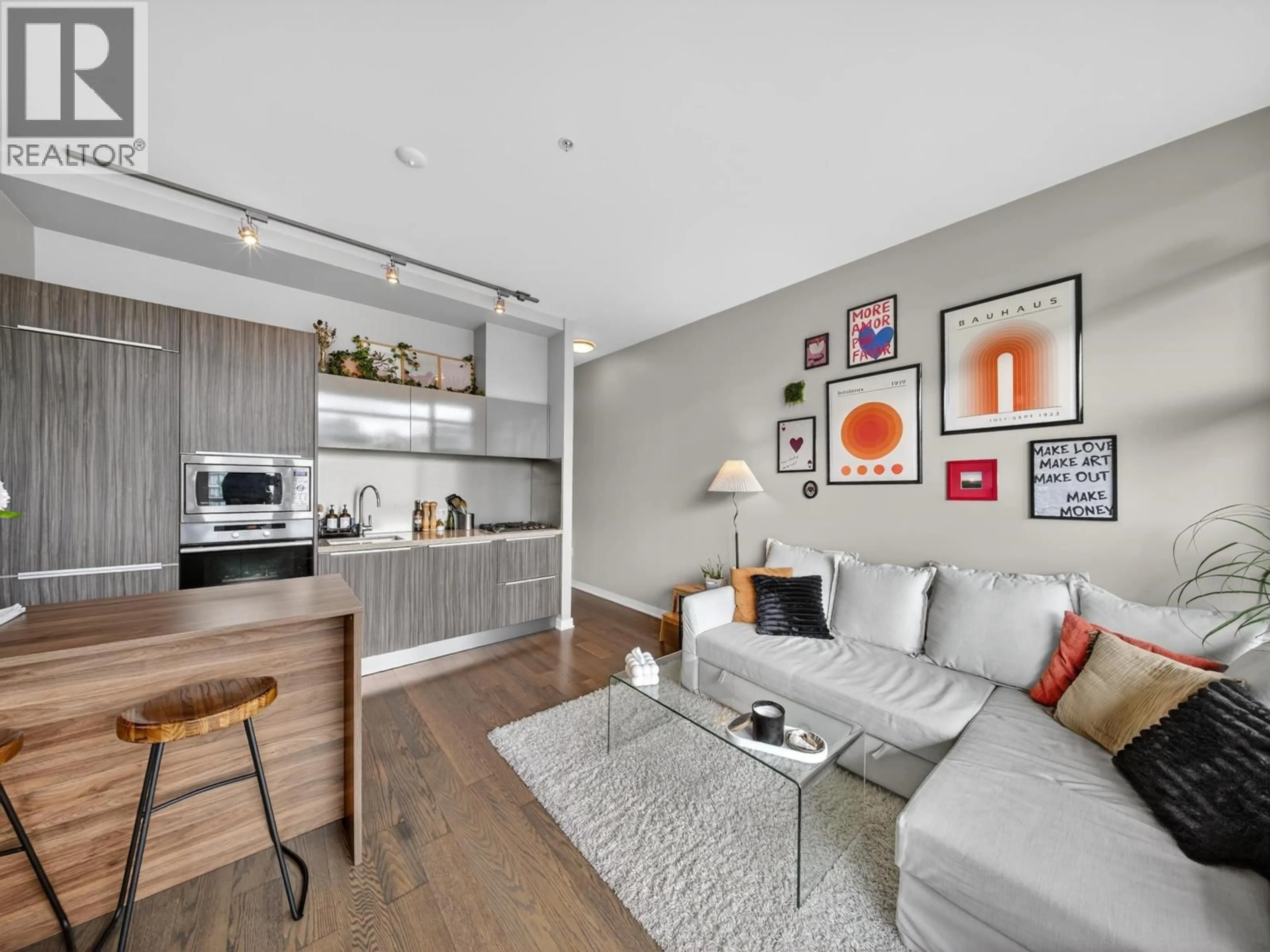 Living room with furniture, wood/laminate floor for 704 - 123 1ST AVENUE, Vancouver British Columbia V5Y0E2