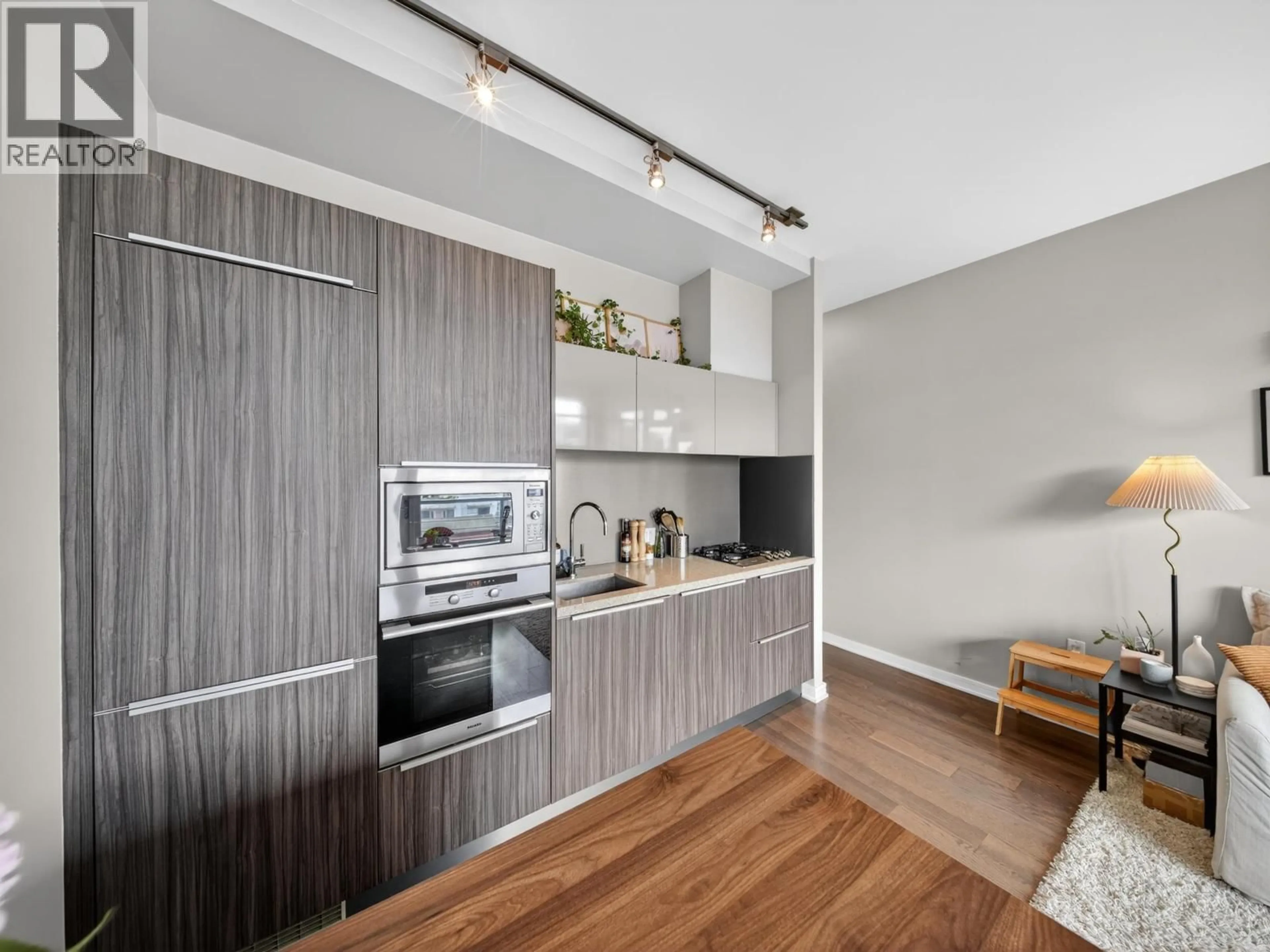 Open concept kitchen, wood/laminate floor for 704 - 123 1ST AVENUE, Vancouver British Columbia V5Y0E2