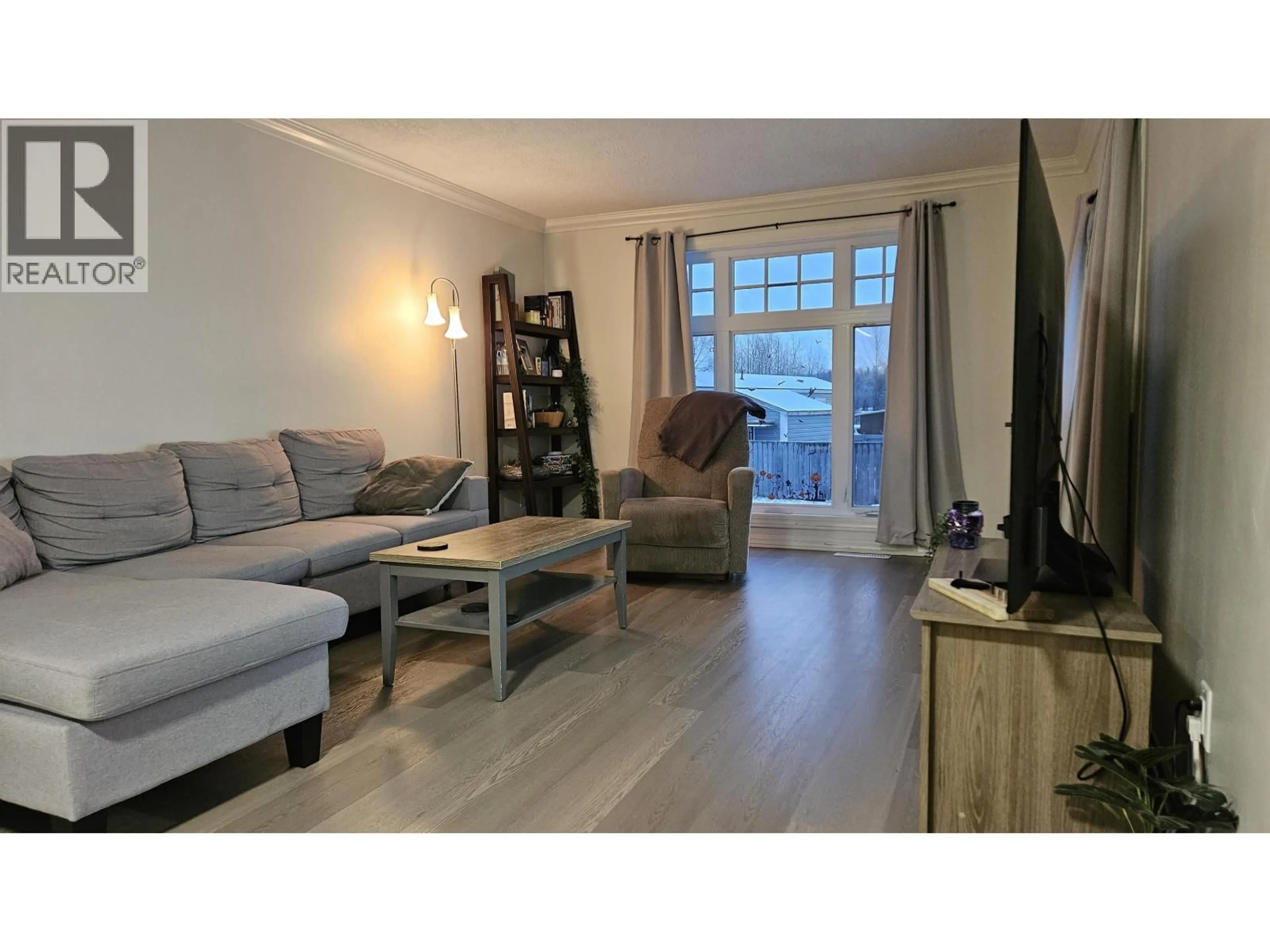 Living room with furniture, wood/laminate floor for A7 - 5931 COOK COURT, Prince George British Columbia V2K1V5