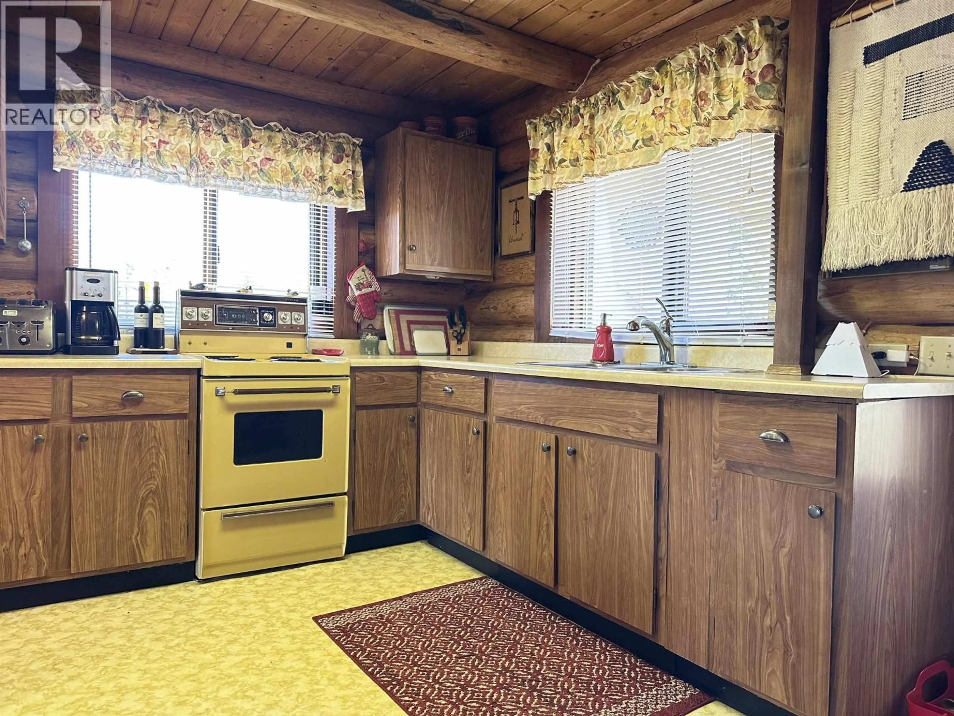 Standard kitchen, wood/laminate floor for 6640 RAYFIELD ROAD, 70 Mile House British Columbia V0K2K2