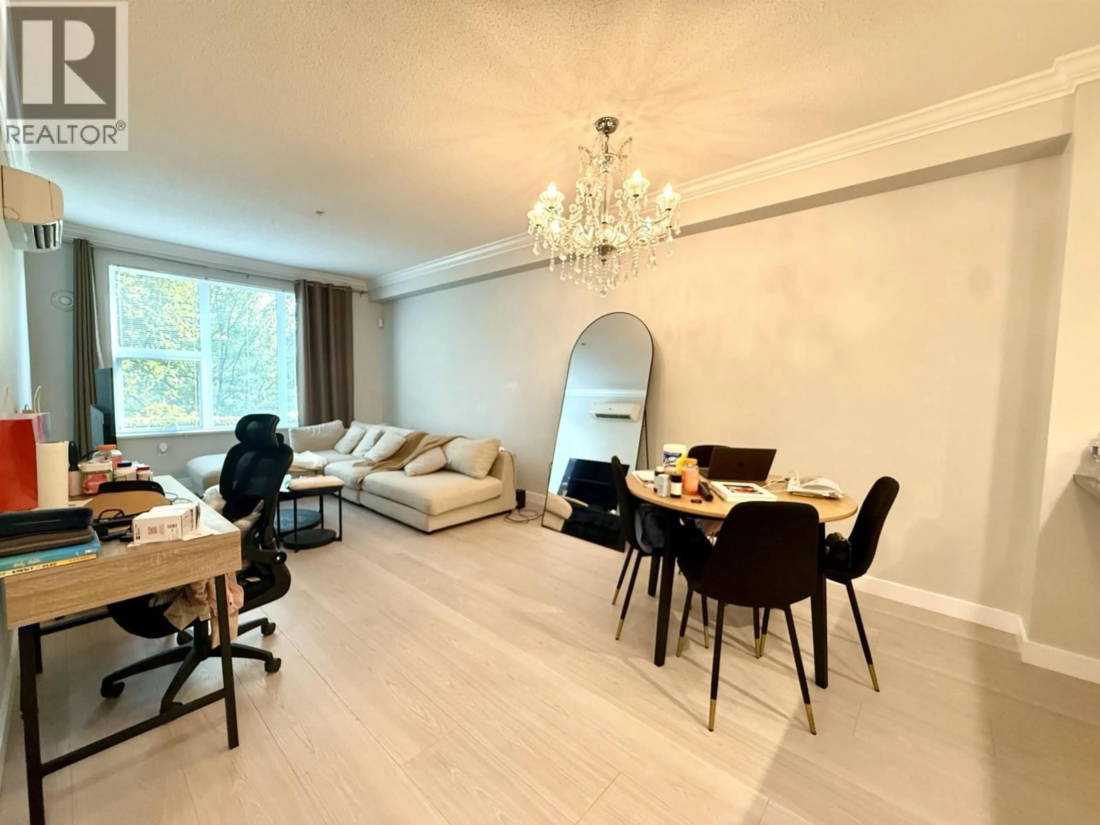 Living room with furniture, wood/laminate floor for 102 - 9399 ALEXANDRA ROAD, Richmond British Columbia V6X0L7