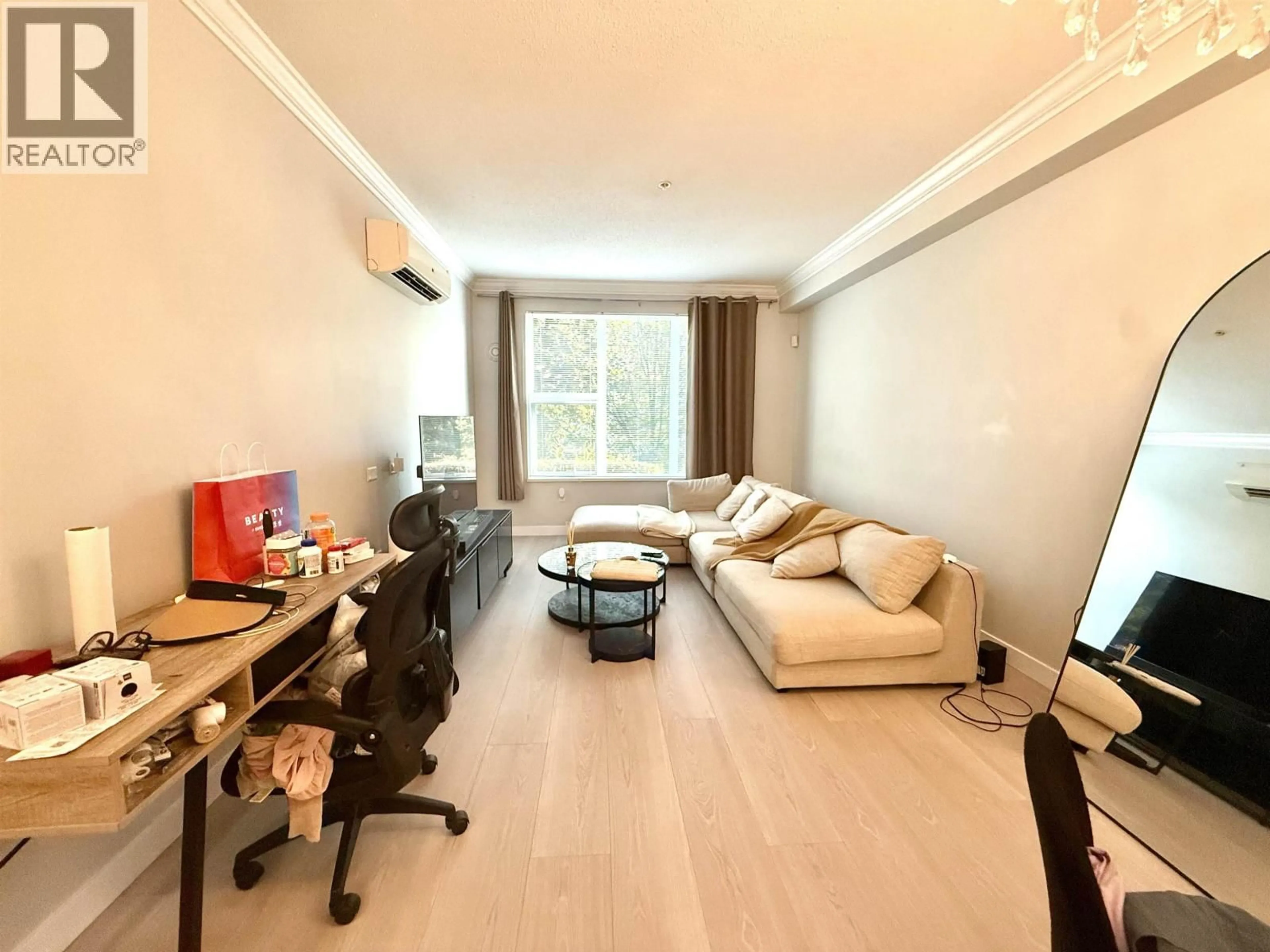 Living room with furniture, wood/laminate floor for 102 - 9399 ALEXANDRA ROAD, Richmond British Columbia V6X0L7