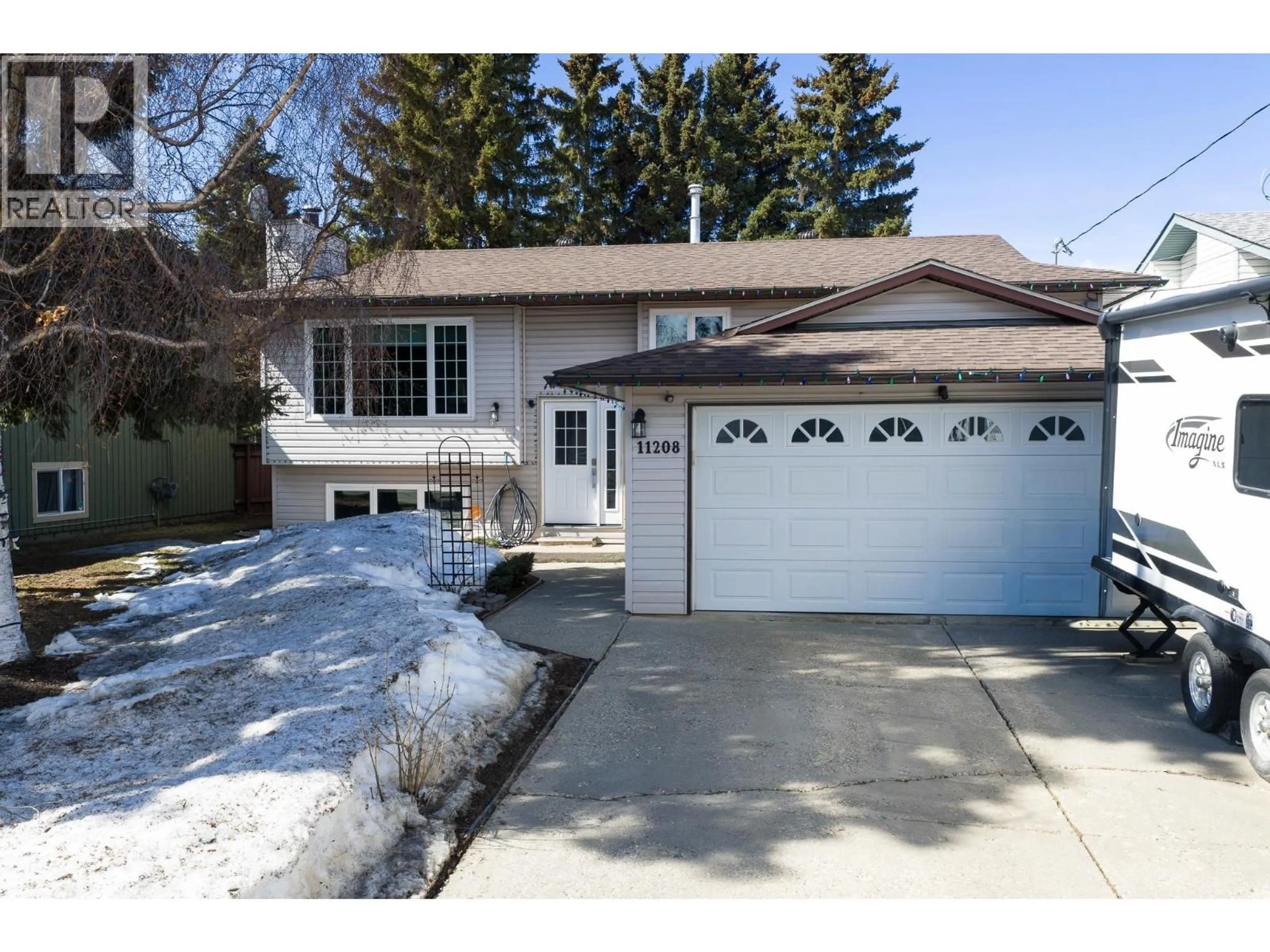 Home with vinyl exterior material, street for 11208 106 STREET, Fort St. John British Columbia V1J6M4