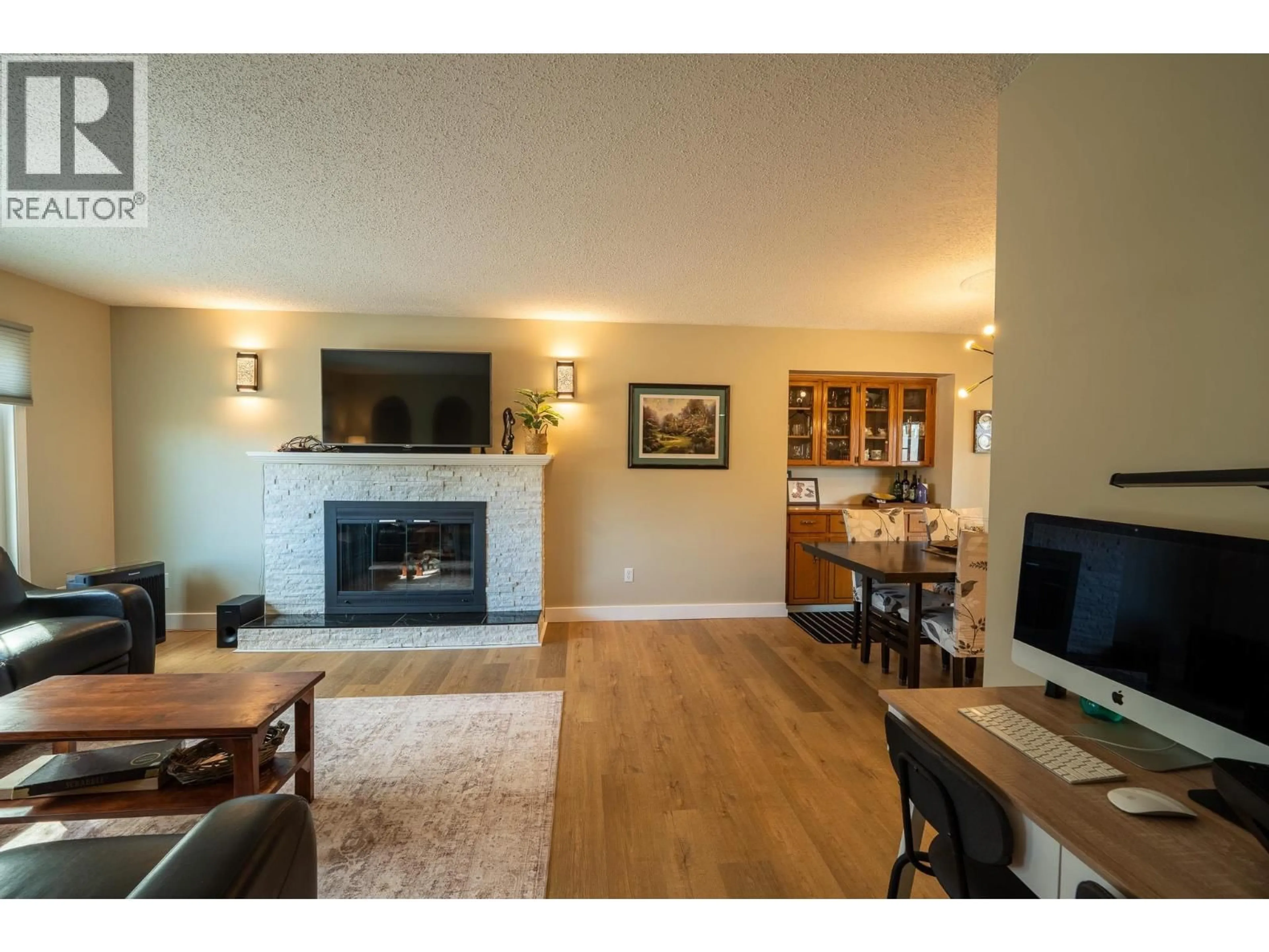 Living room with furniture, wood/laminate floor for 11208 106 STREET, Fort St. John British Columbia V1J6M4