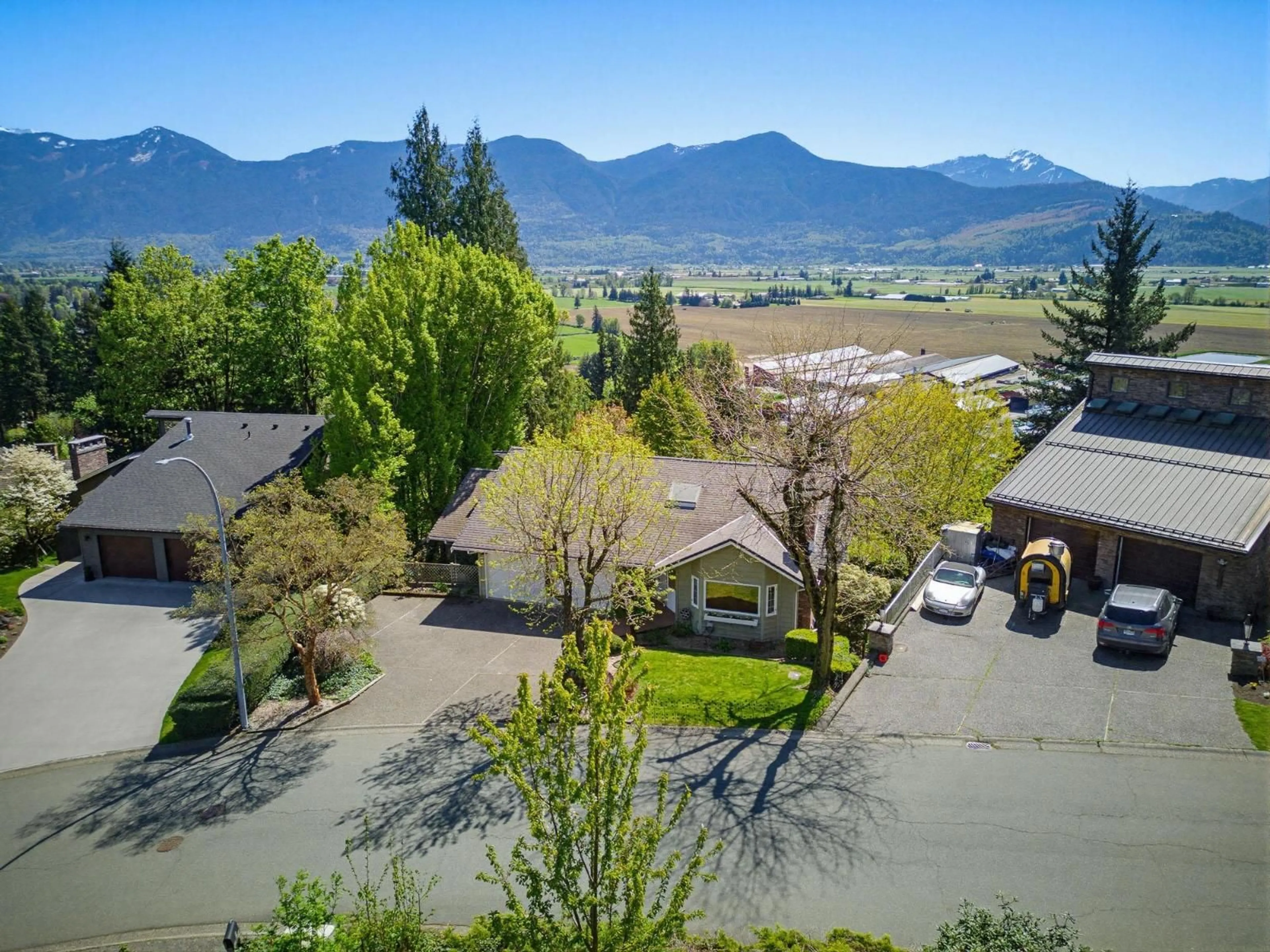 A pic from outside/outdoor area/front of a property/back of a property/a pic from drone, mountain view for 10026 FALCON CRESCENT, Chilliwack British Columbia V2P7R3