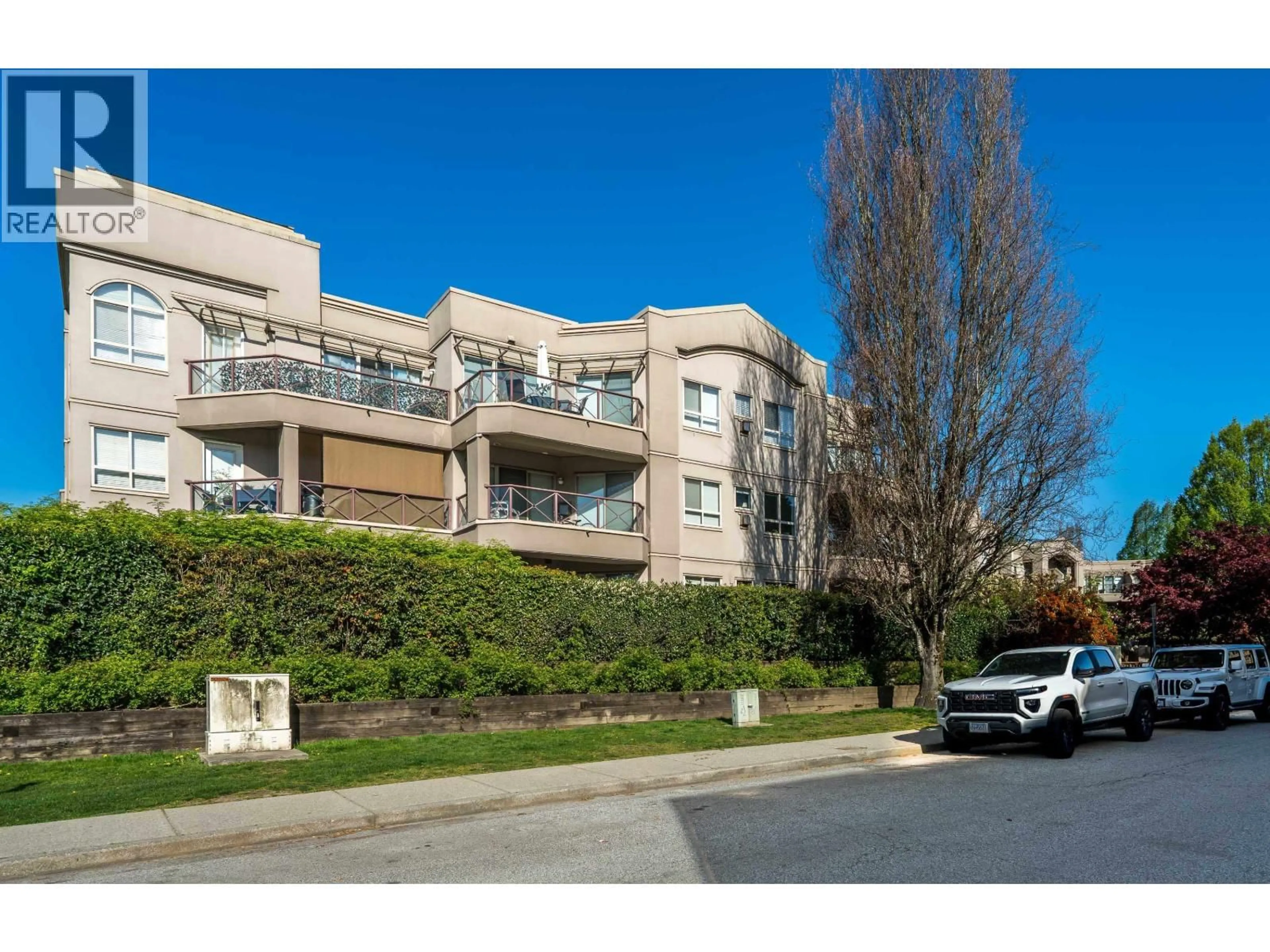 A pic from outside/outdoor area/front of a property/back of a property/a pic from drone, street for 104 - 2109 ROWLAND STREET, Port Coquitlam British Columbia V3C6J4