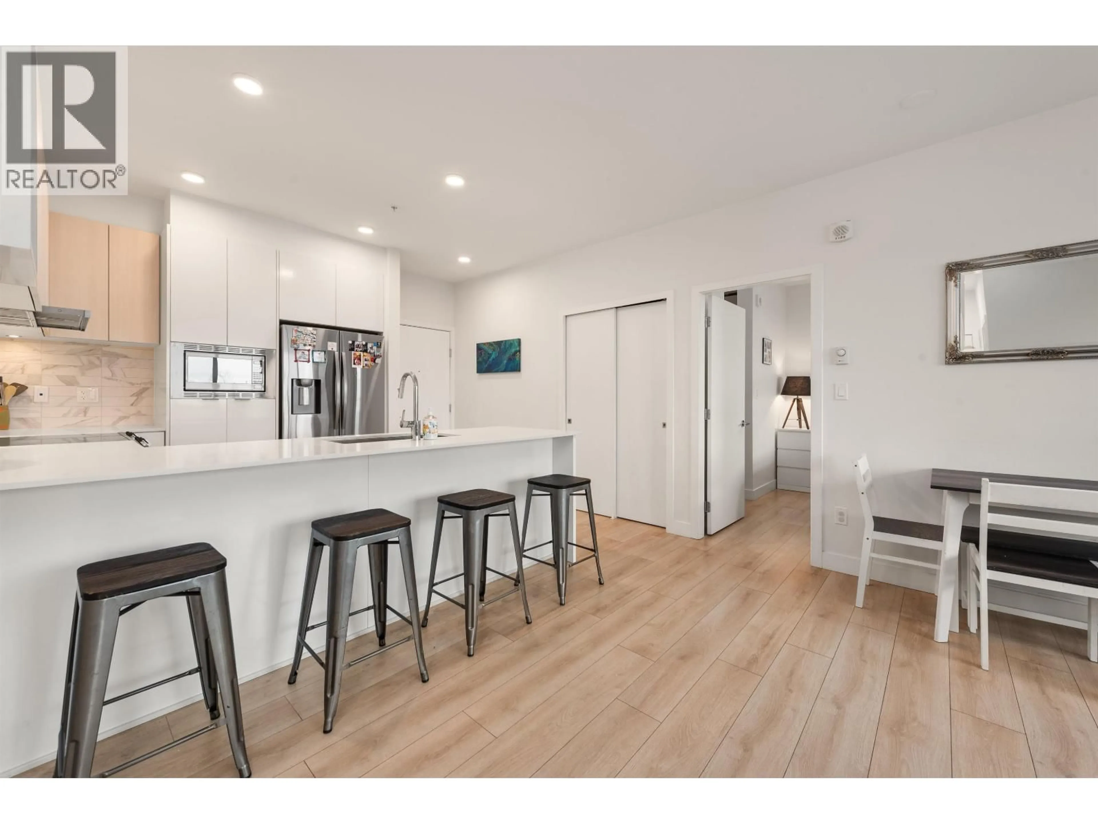 Open concept kitchen, wood/laminate floor for 227 - 1792 STARLING DRIVE, Delta British Columbia V4M0E4