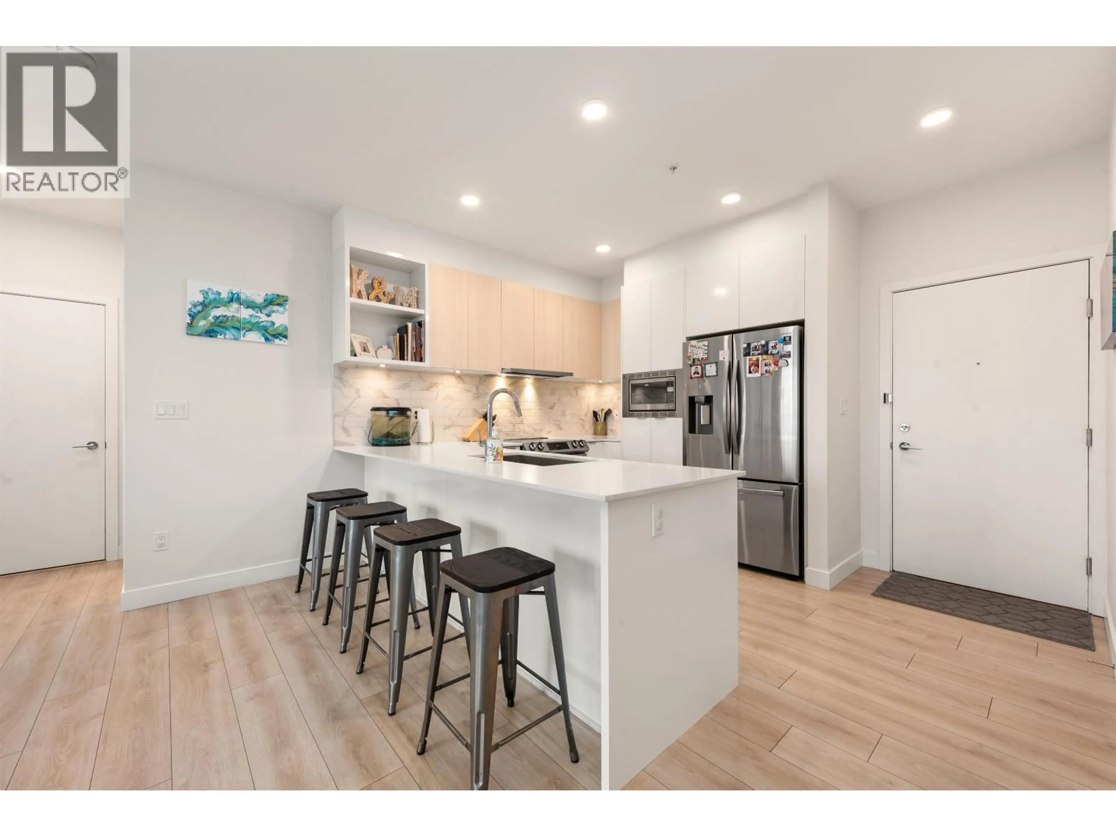 Open concept kitchen, wood/laminate floor for 227 - 1792 STARLING DRIVE, Delta British Columbia V4M0E4