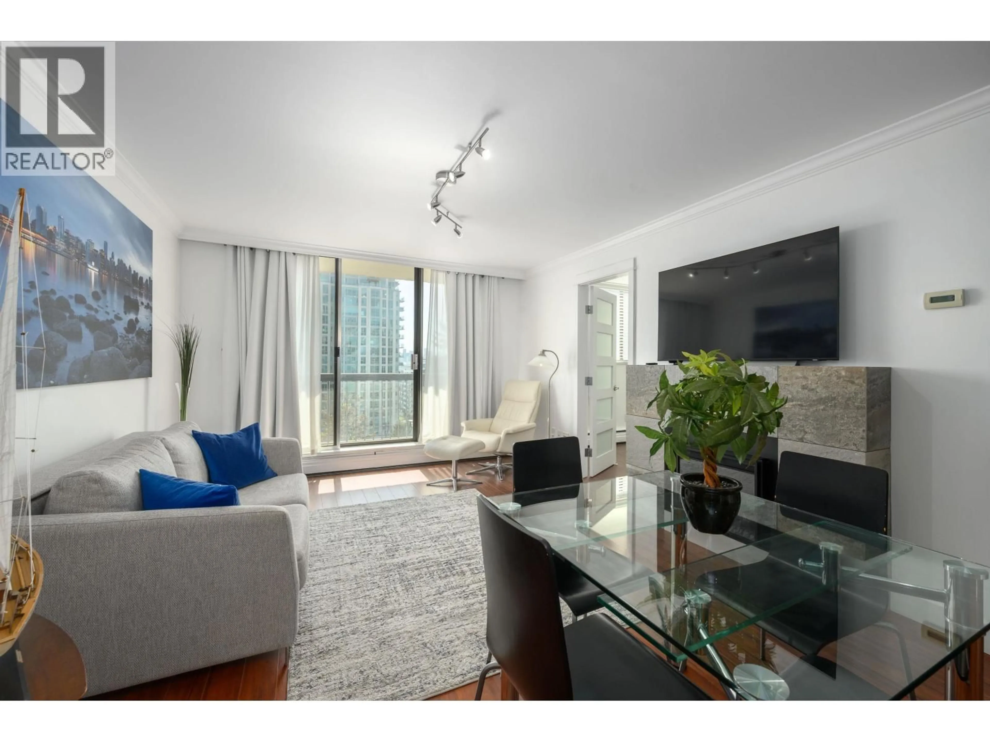 Living room with furniture, wood/laminate floor for 608 - 145 ST. GEORGES AVENUE, North Vancouver British Columbia V7L3G8