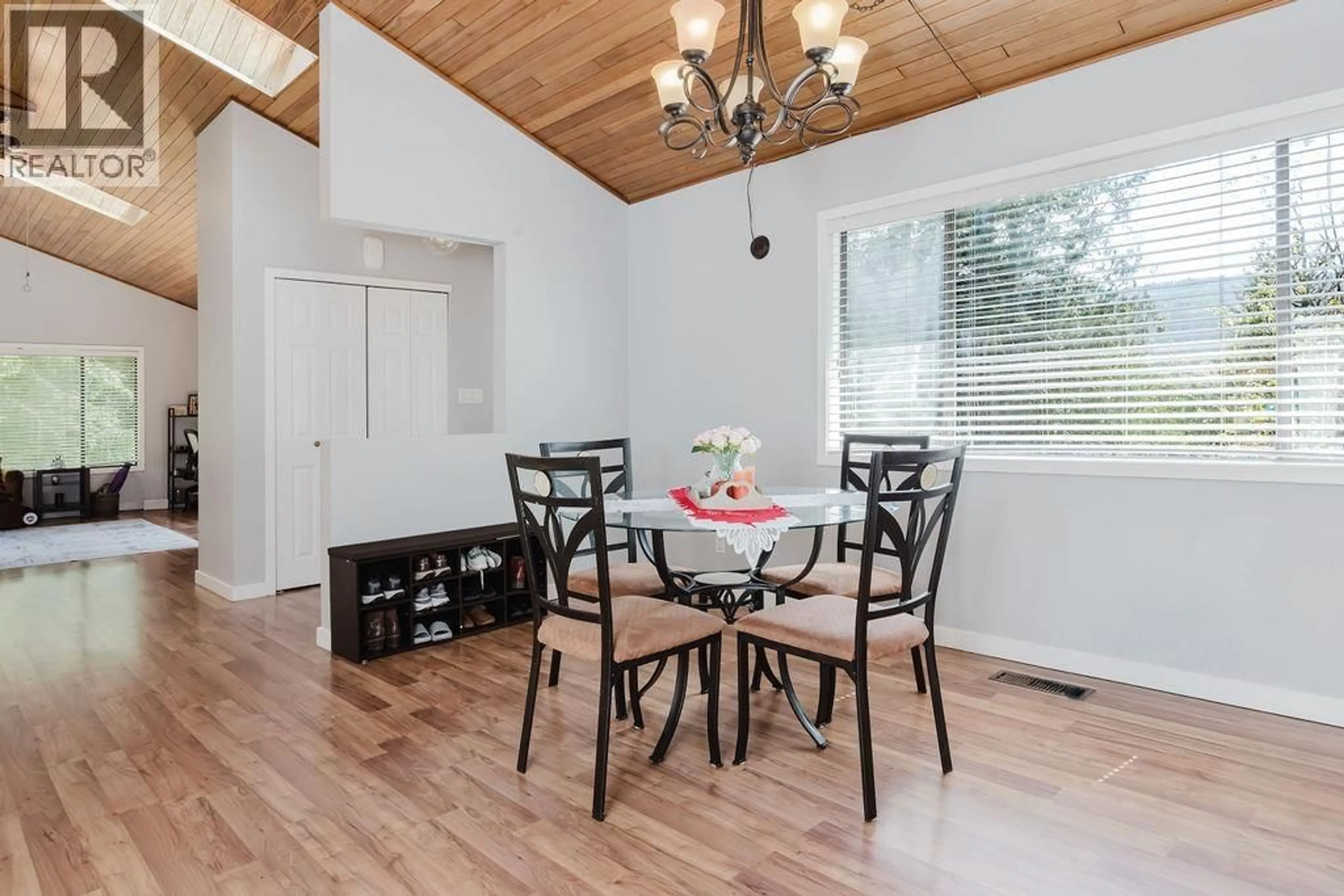 Dining room, wood/laminate floor for 5899 SPRIGGS ROAD, Madeira Park British Columbia V0N2H0