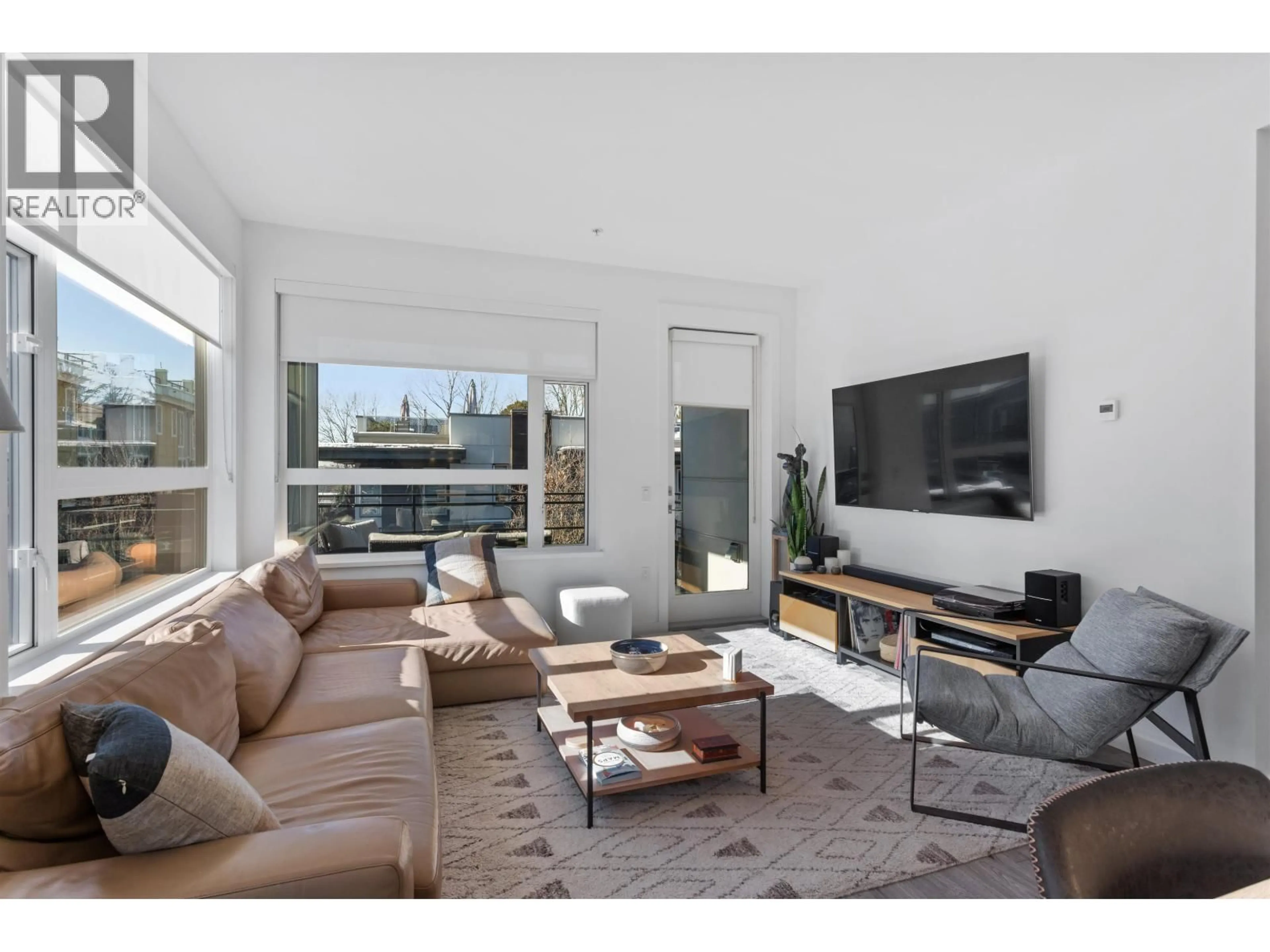 Living room with furniture, unknown for 204 - 715 15TH STREET, North Vancouver British Columbia V7M1T2