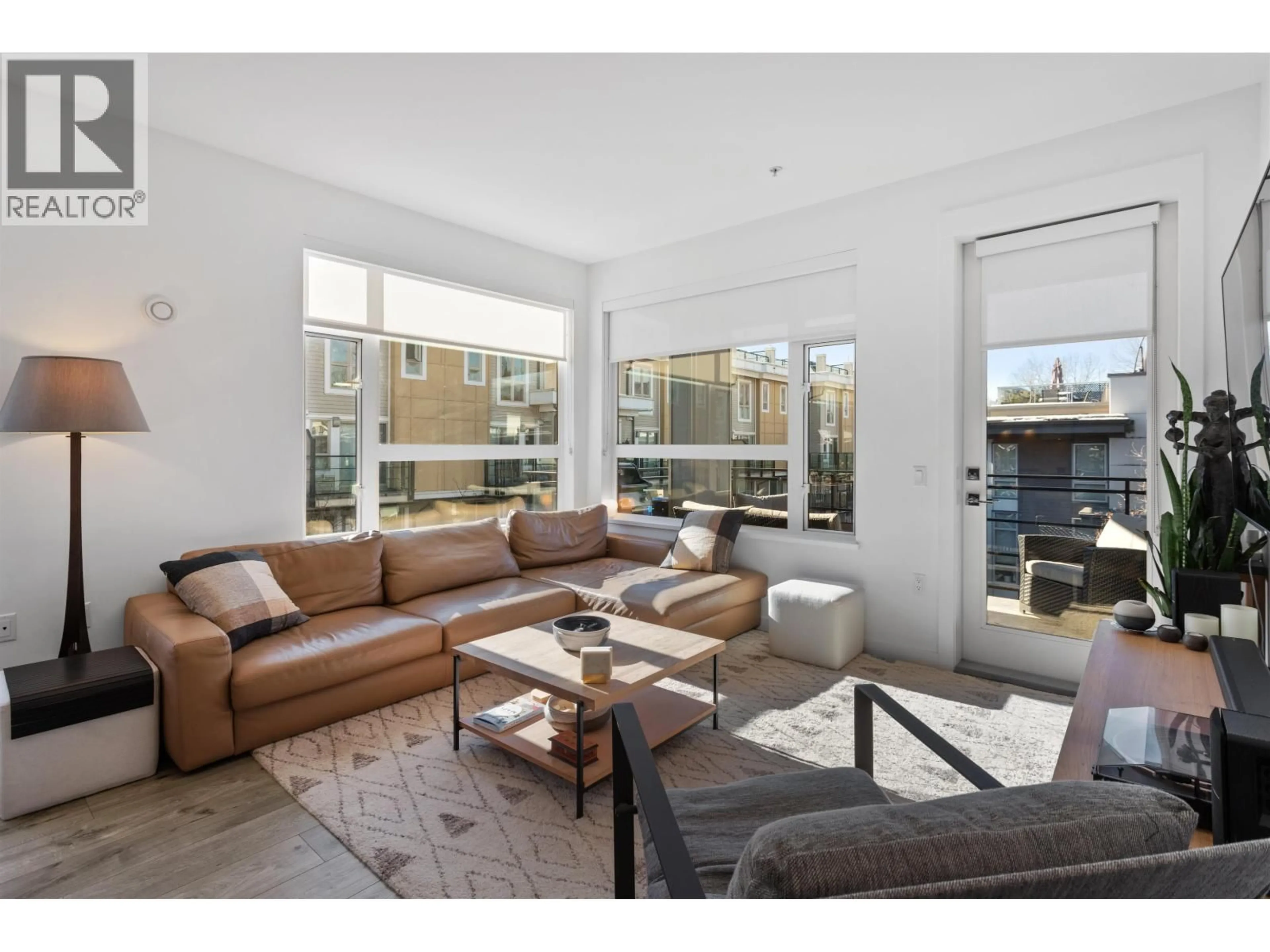 Living room with furniture, unknown for 204 - 715 15TH STREET, North Vancouver British Columbia V7M1T2