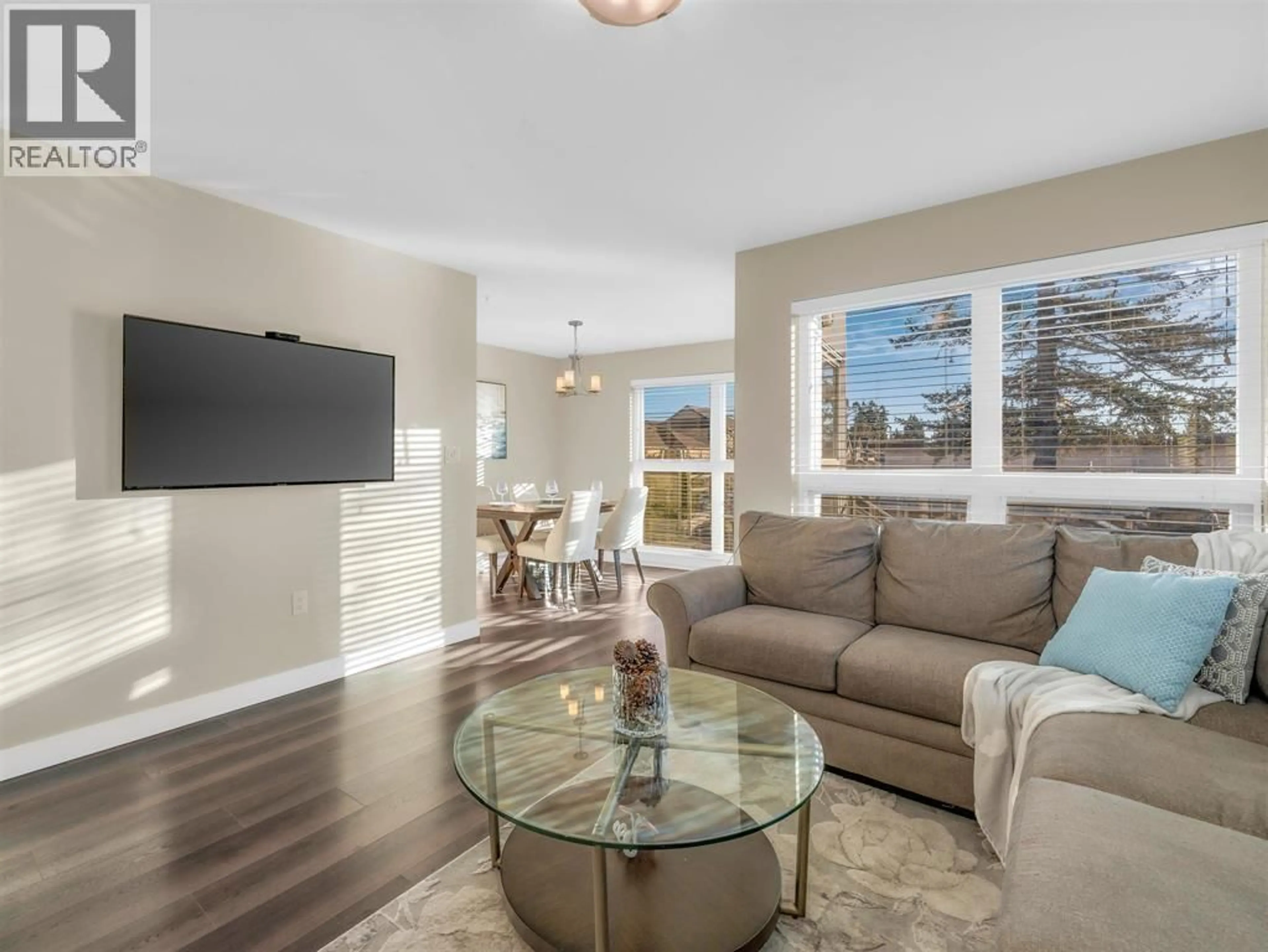 Living room with furniture, wood/laminate floor for 105 - 4815 55B STREET, Delta British Columbia V4K3V7