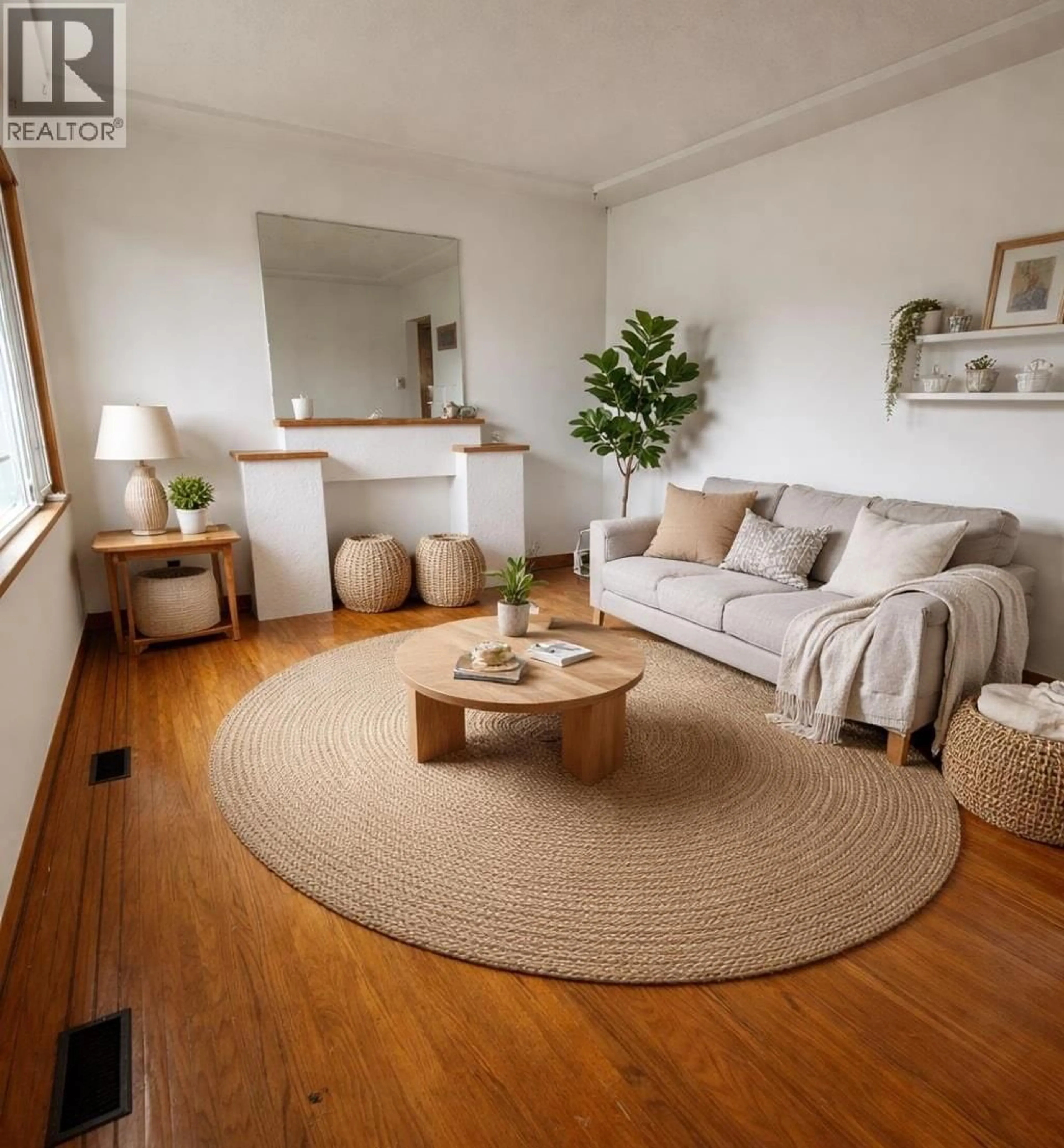 Living room with furniture, wood/laminate floor for 7544 MAIN STREET, Vancouver British Columbia V5X3J9