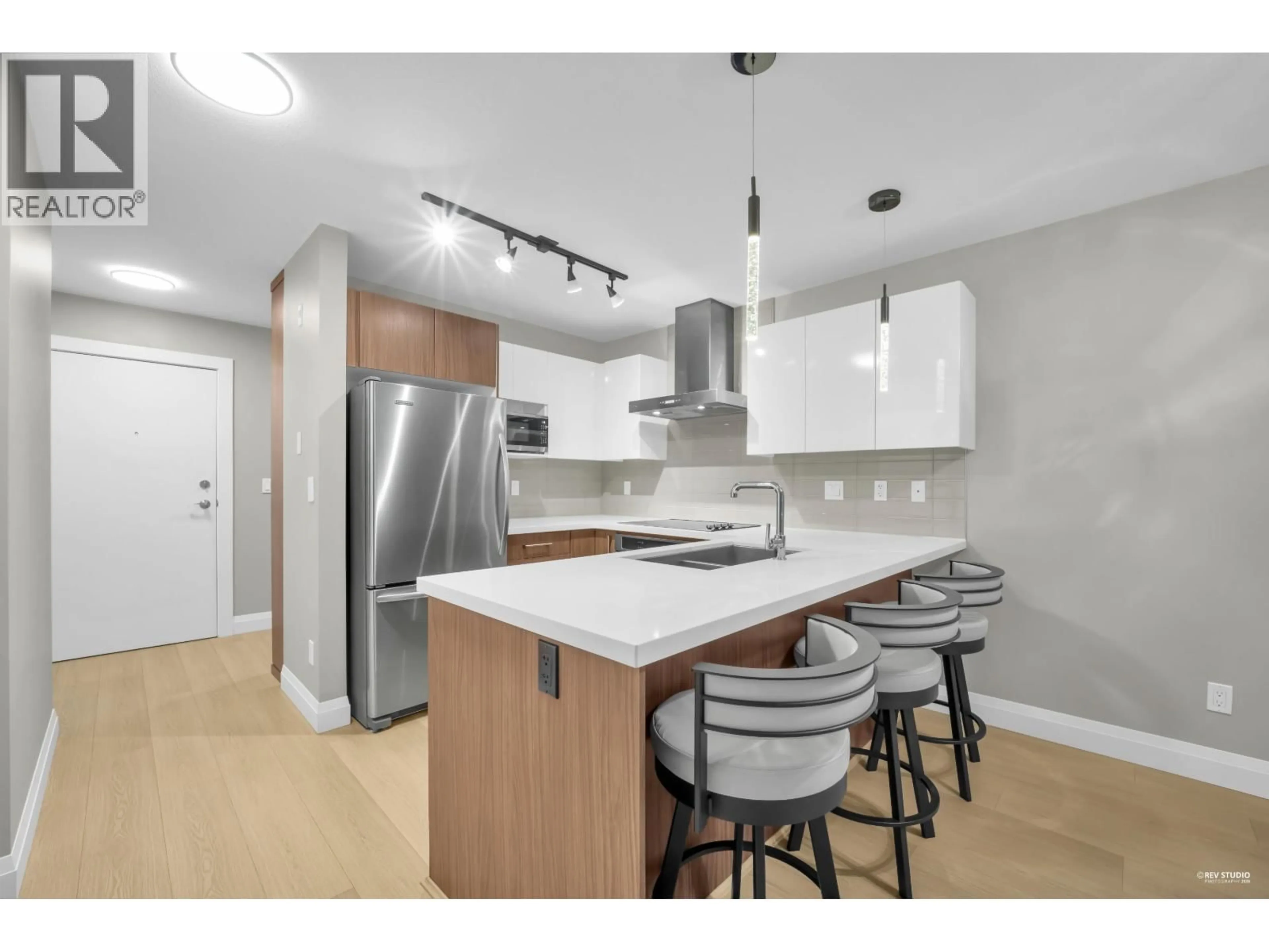 Open concept kitchen, wood/laminate floor for 416 - 7131 STRIDE AVENUE, Burnaby British Columbia V3N0E3