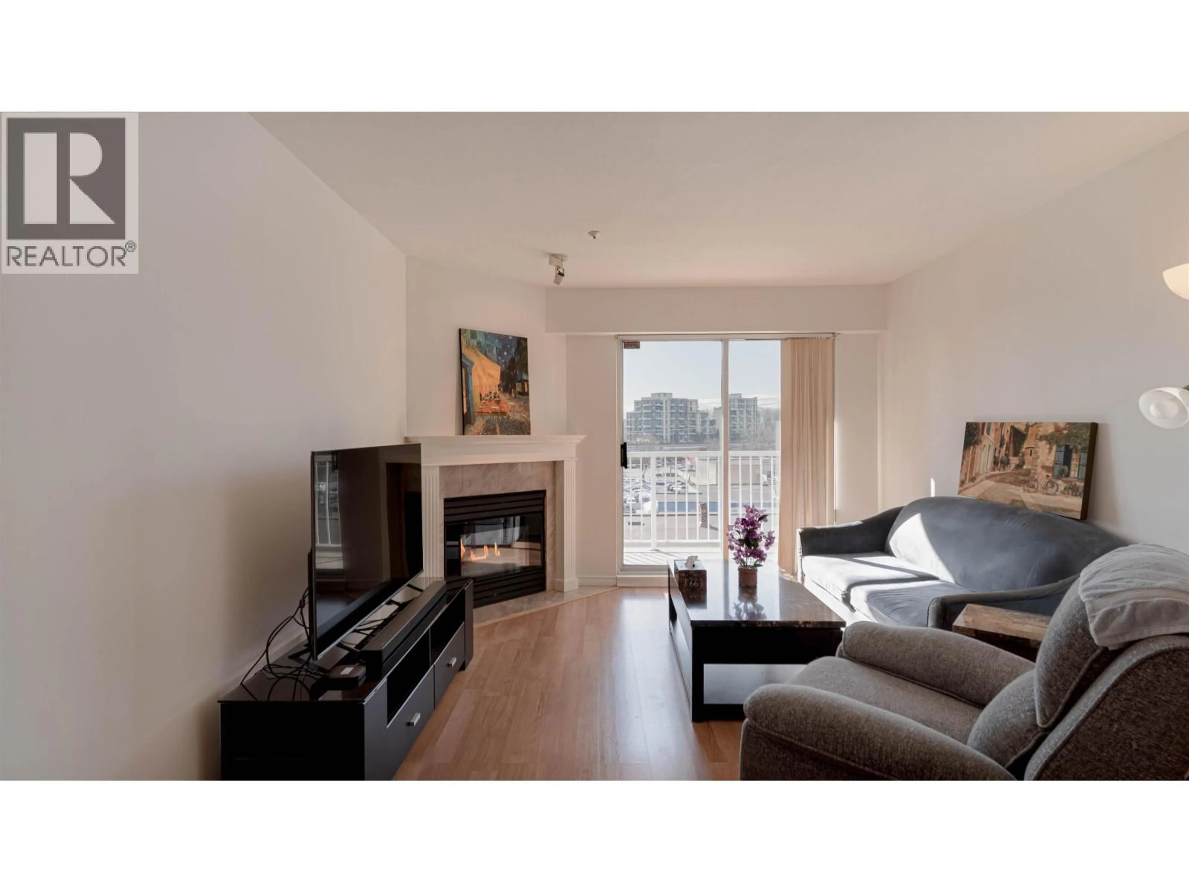 Living room with furniture, wood/laminate floor for 303 - 1035 AUCKLAND STREET, New Westminster British Columbia V3M1K9