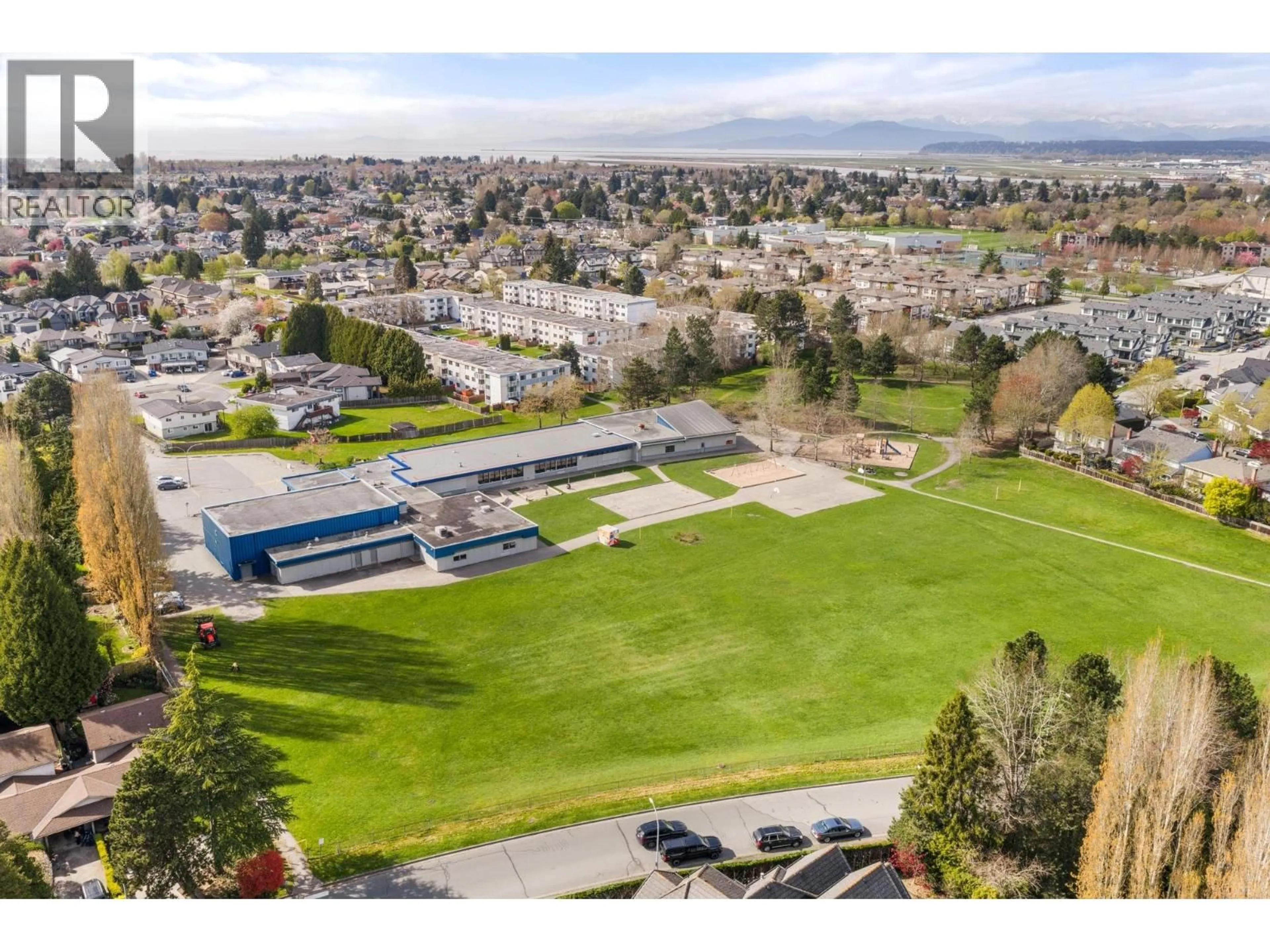 A pic from outside/outdoor area/front of a property/back of a property/a pic from drone, mountain view for 306 - 7240 LINDSAY ROAD, Richmond British Columbia V7C3M6