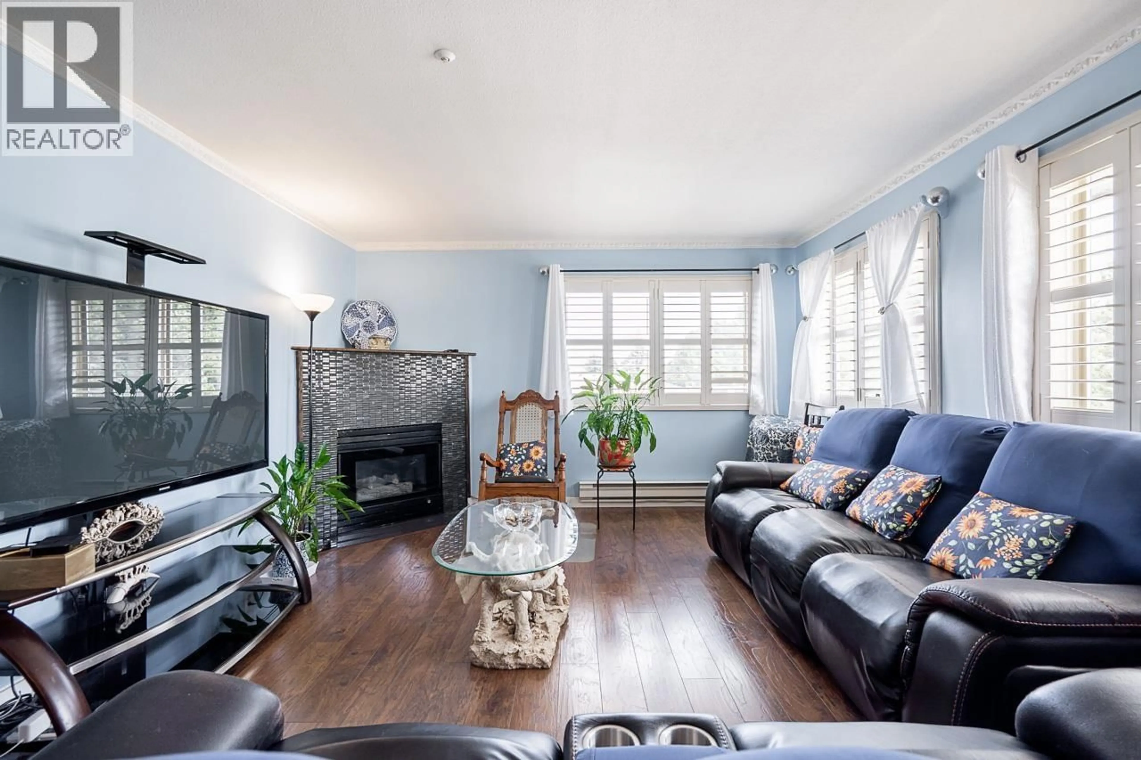 Living room with furniture, wood/laminate floor for 301 - 19128 FORD ROAD, Pitt Meadows British Columbia V3Y2P1