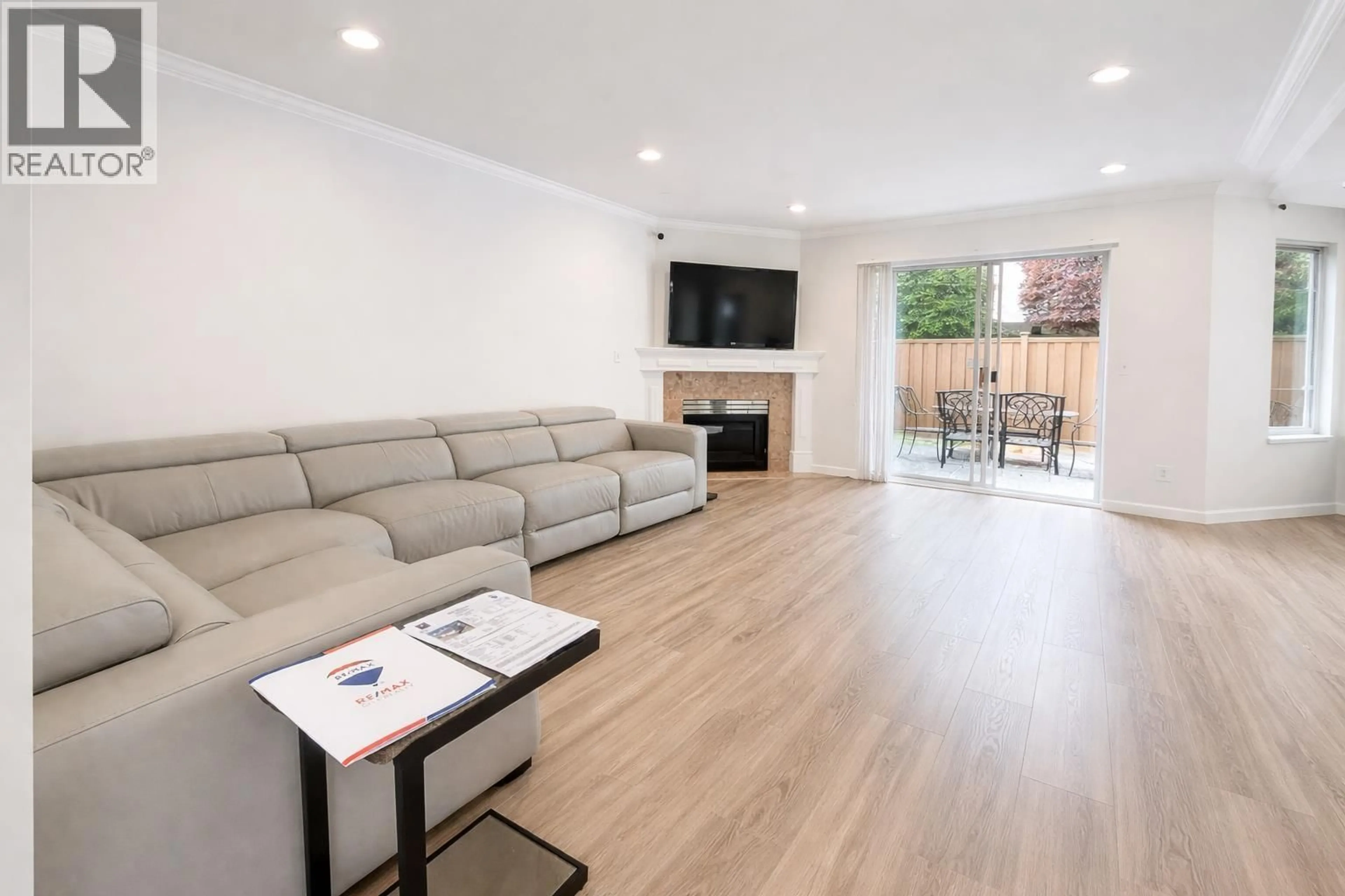 Living room with furniture, wood/laminate floor for 34 - 8051 ASH STREET, Richmond British Columbia V6Y3X6