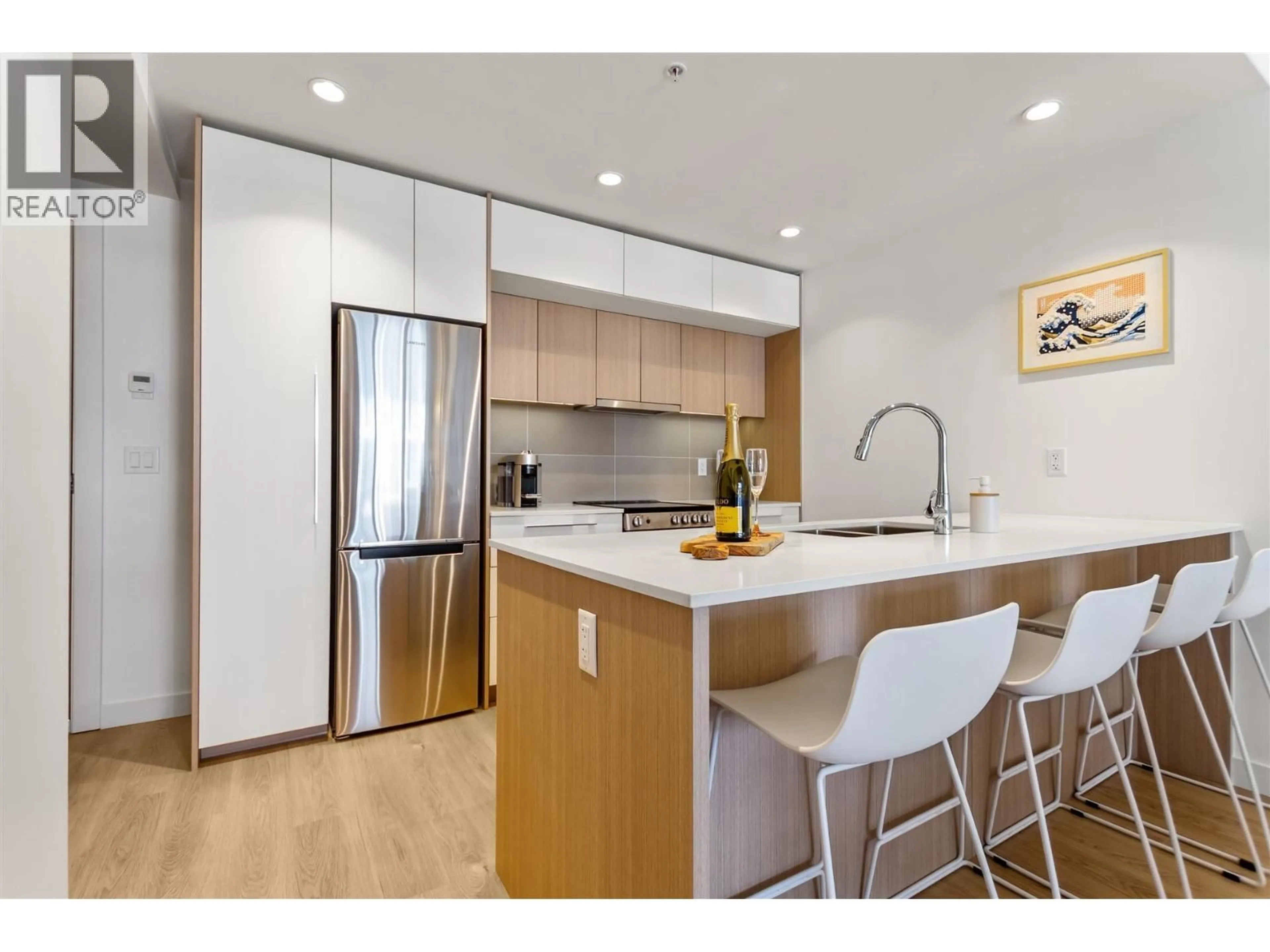 Open concept kitchen, wood/laminate floor for 203 - 9580 TOWER ROAD, Burnaby British Columbia V5A0G5