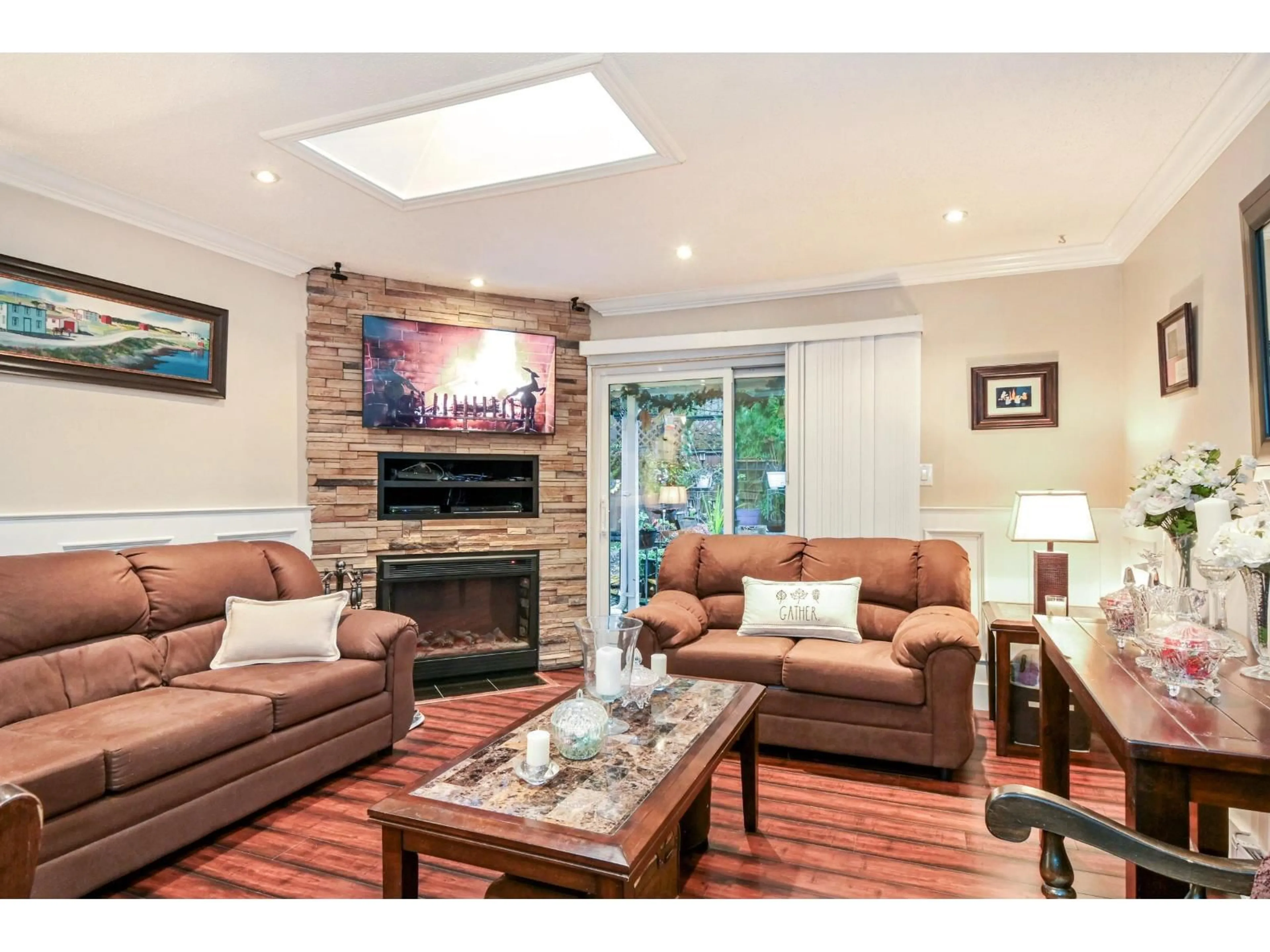 Living room with furniture, wood/laminate floor for 8037 139A STREET, Surrey British Columbia V3W6P9