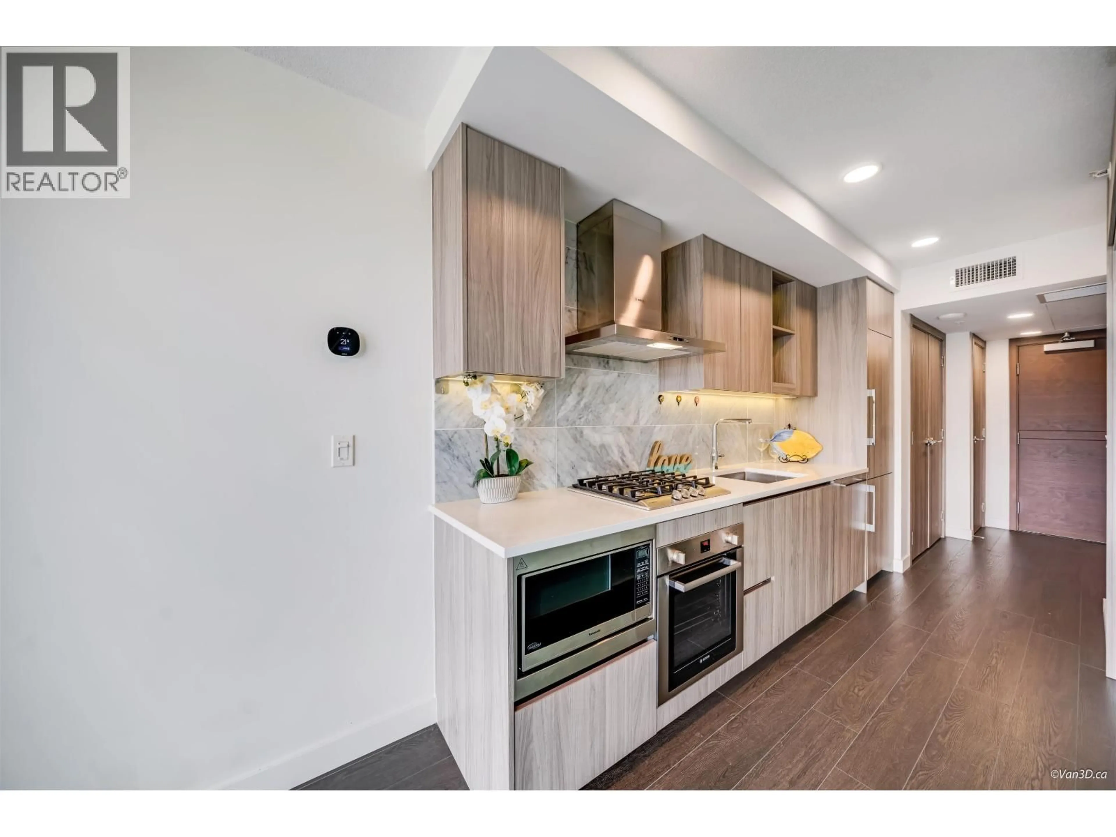 Open concept kitchen, wood/laminate floor for 618 - 8800 HAZELBRIDGE WAY, Richmond British Columbia V6X0S3