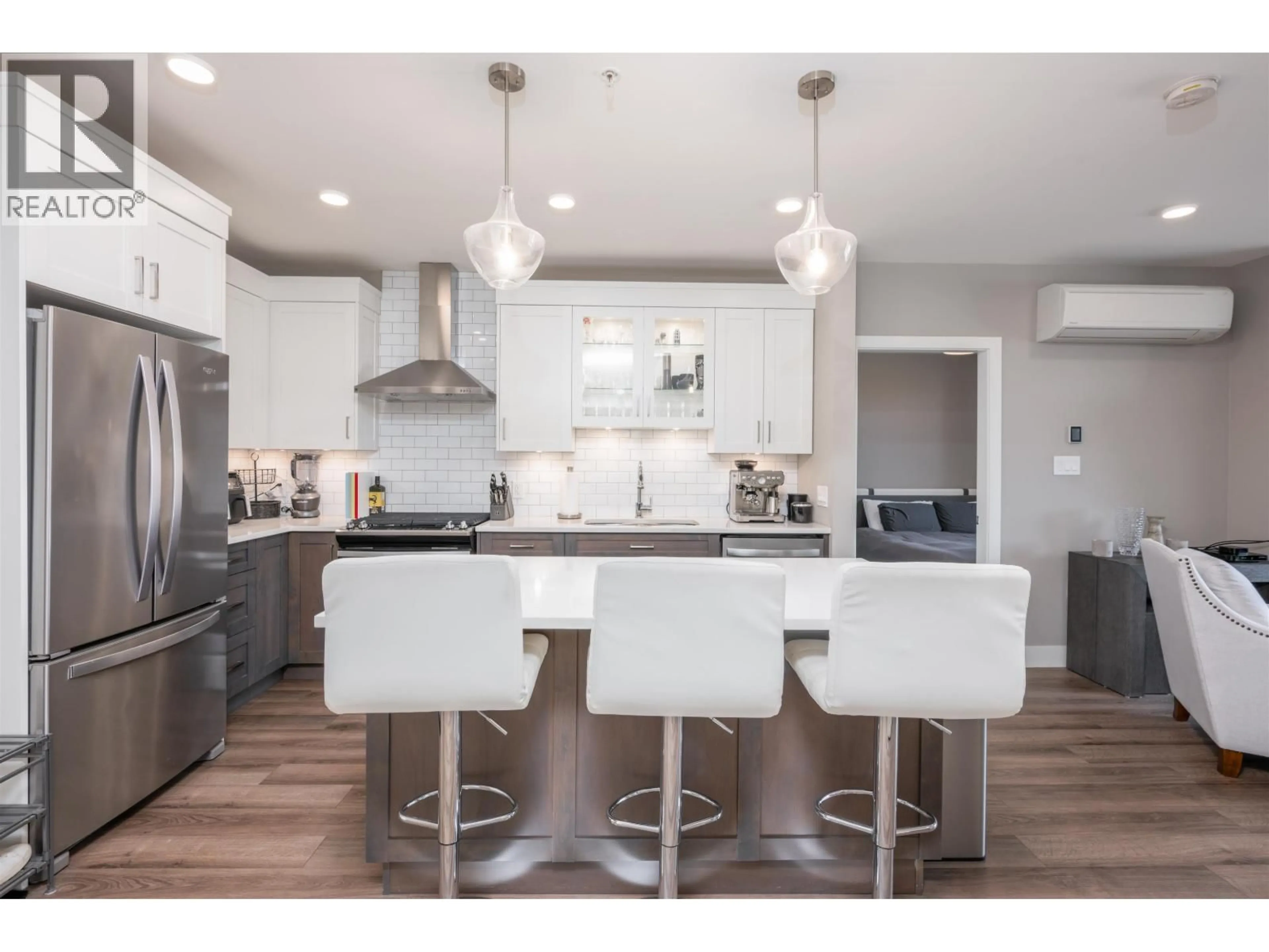 Open concept kitchen, wood/laminate floor for 104 - 1087 6TH AVENUE, Prince George British Columbia V2L0E5