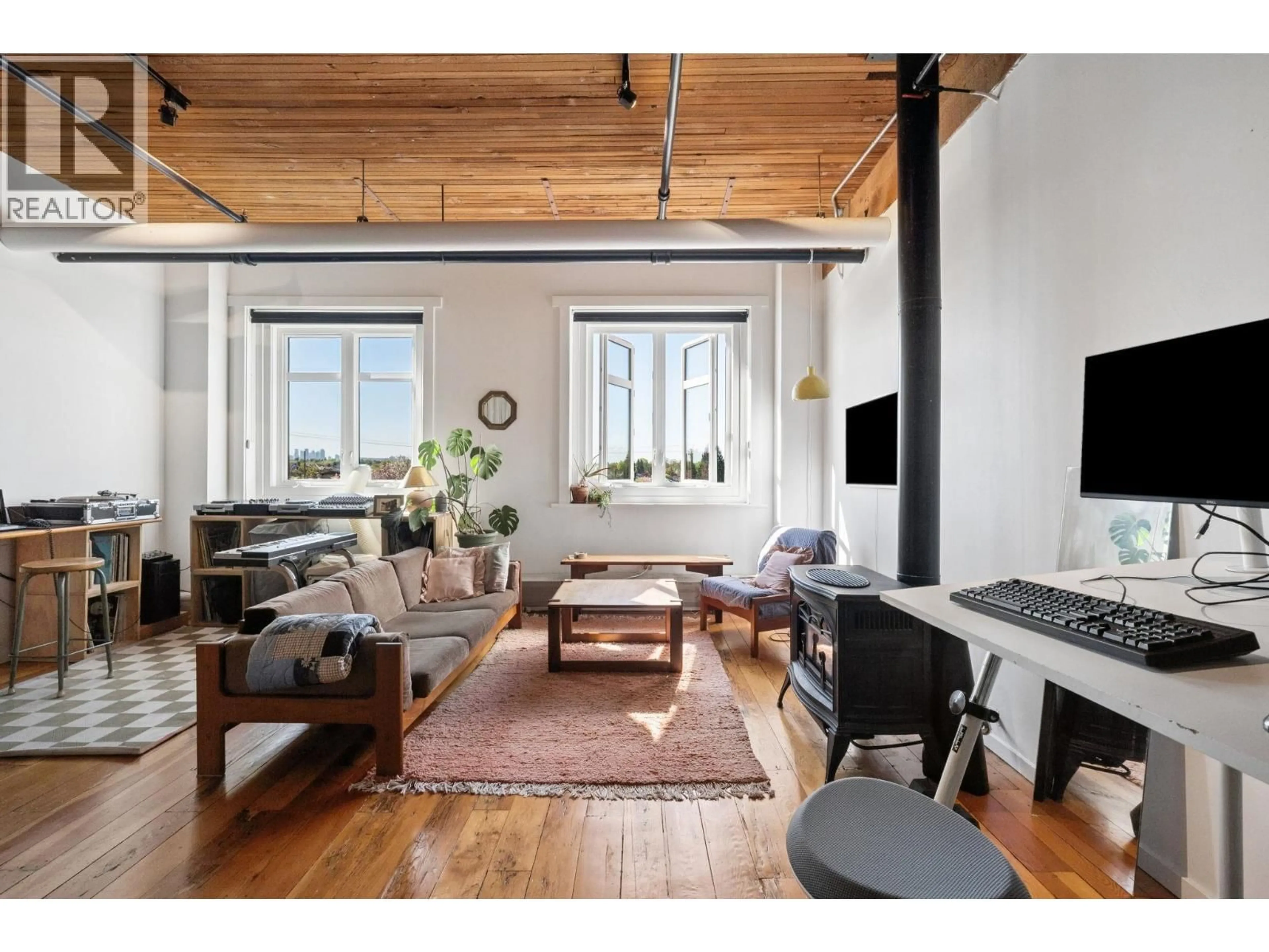 Living room with furniture, wood/laminate floor for 321 - 2556 HASTINGS STREET, Vancouver British Columbia V5K1Z3