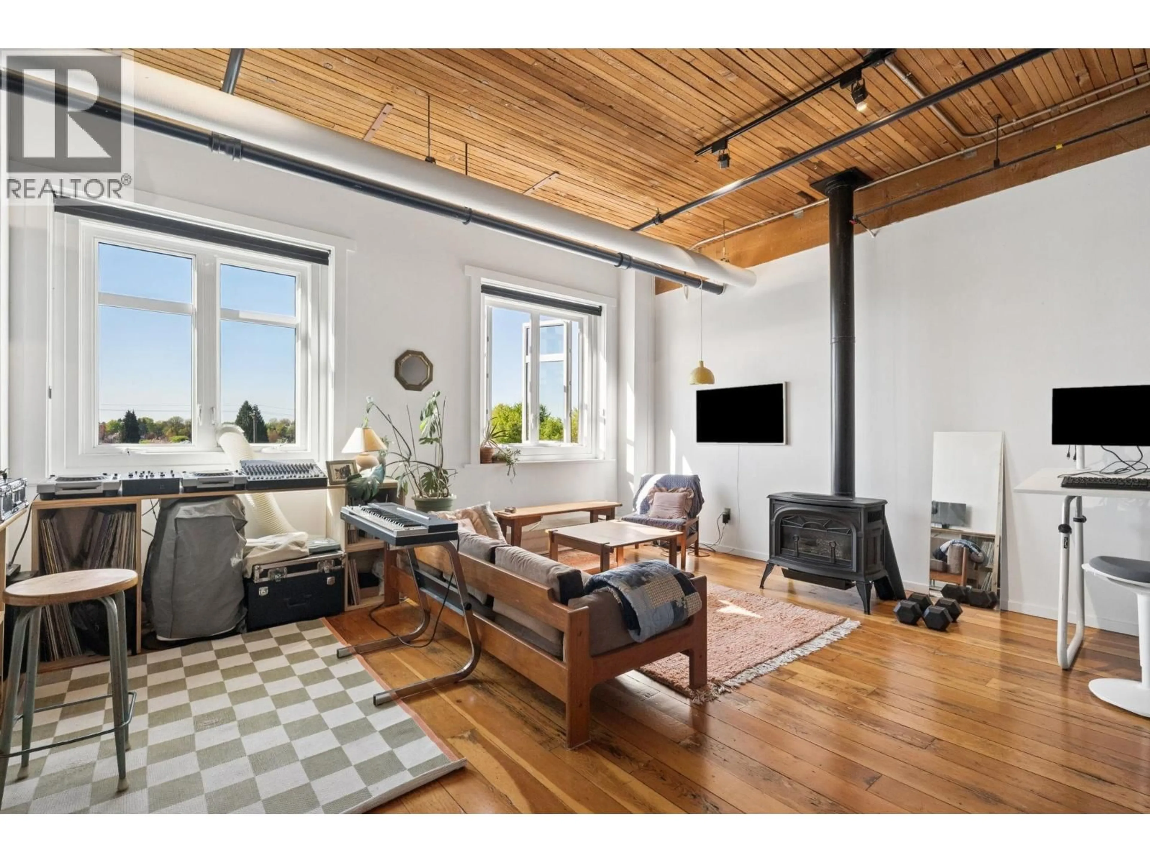 Living room with furniture, wood/laminate floor for 321 - 2556 HASTINGS STREET, Vancouver British Columbia V5K1Z3