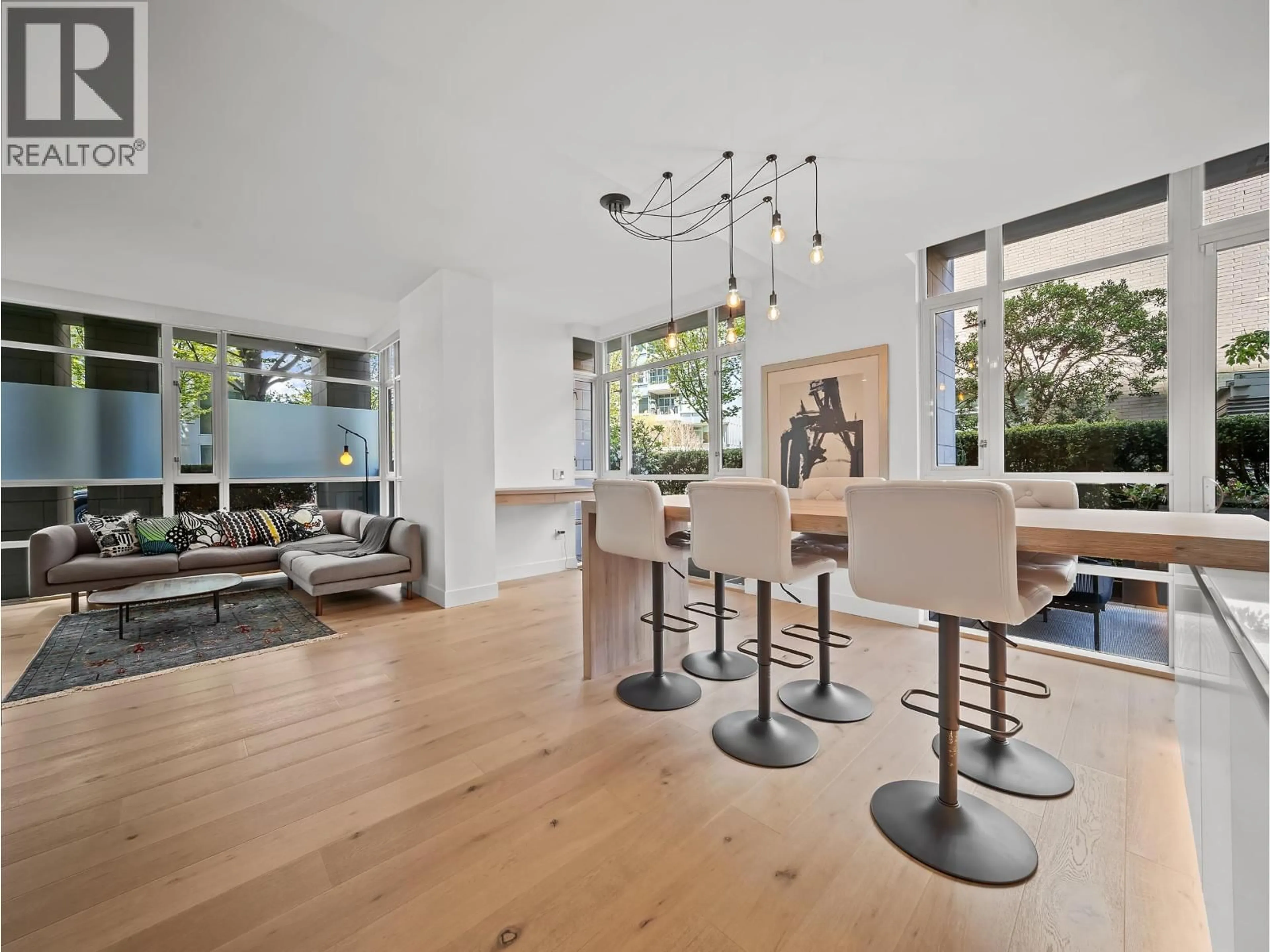 Open concept kitchen, wood/laminate floor for 180 ATHLETES WAY, Vancouver British Columbia V5Y0B5