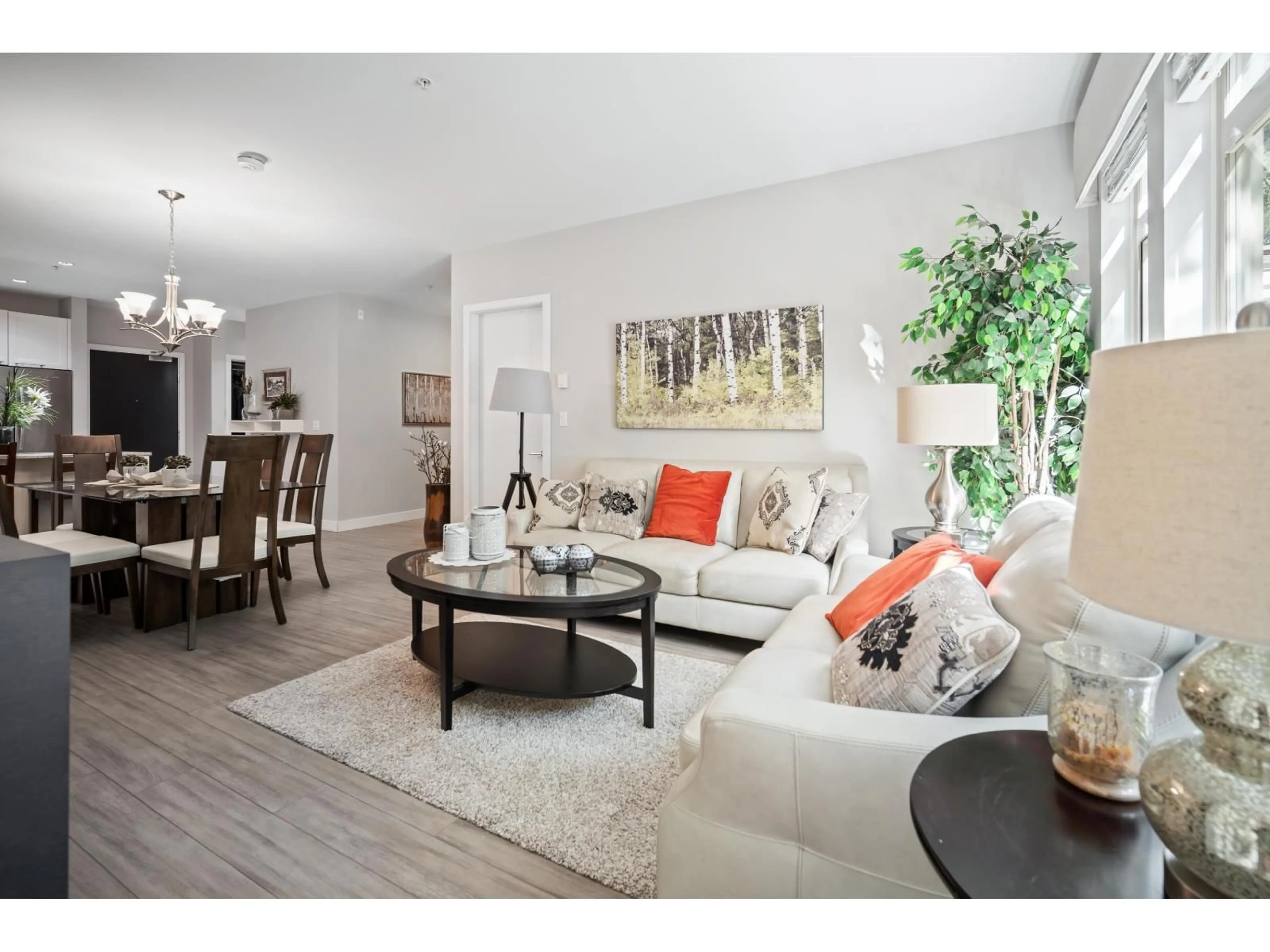 Living room with furniture, wood/laminate floor for 111 - 15360 20 AVENUE, Surrey British Columbia V4A2A3