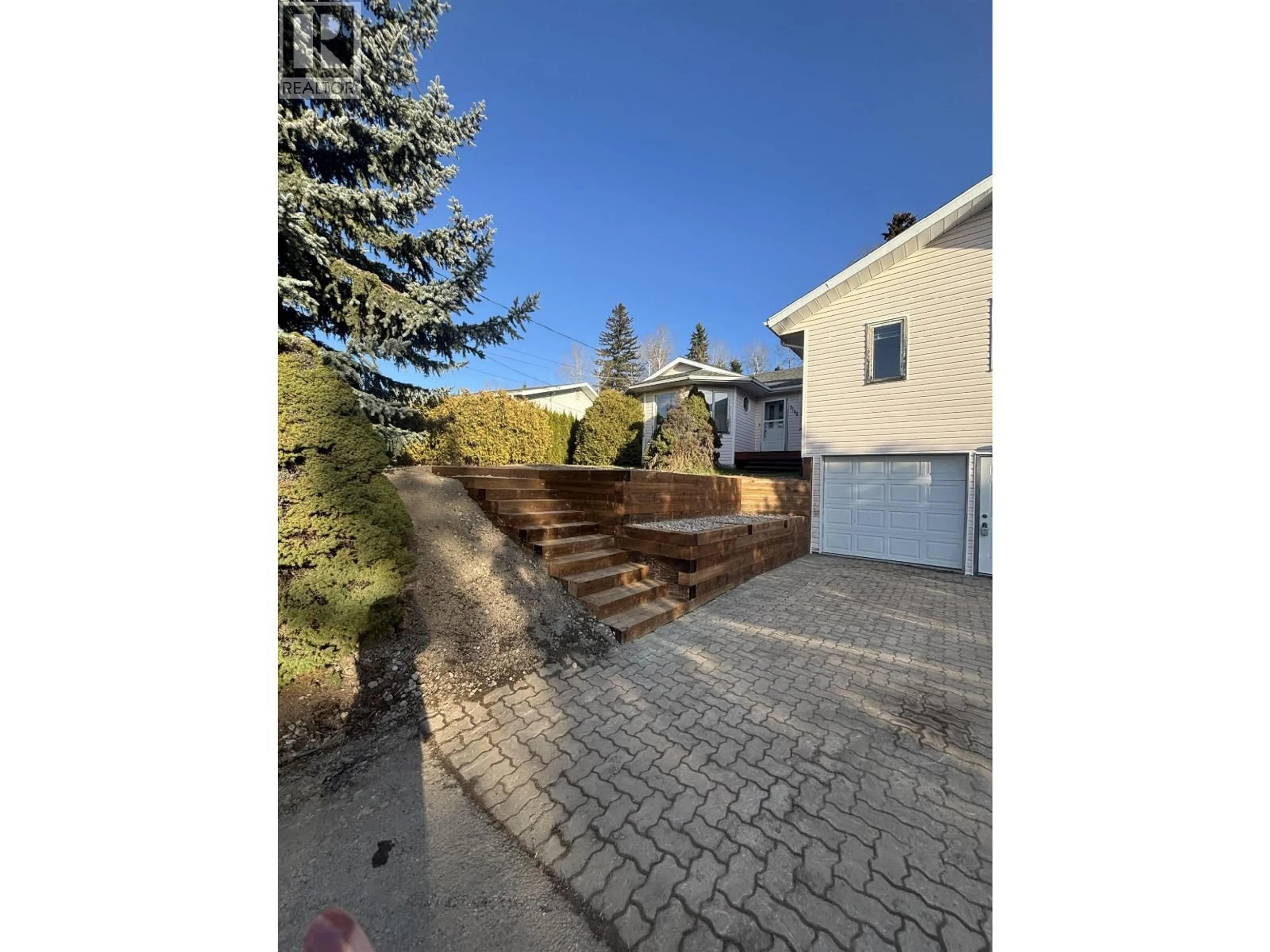 A pic from outside/outdoor area/front of a property/back of a property/a pic from drone, street for 7788 THOMPSON DRIVE, Prince George British Columbia V2N5N5