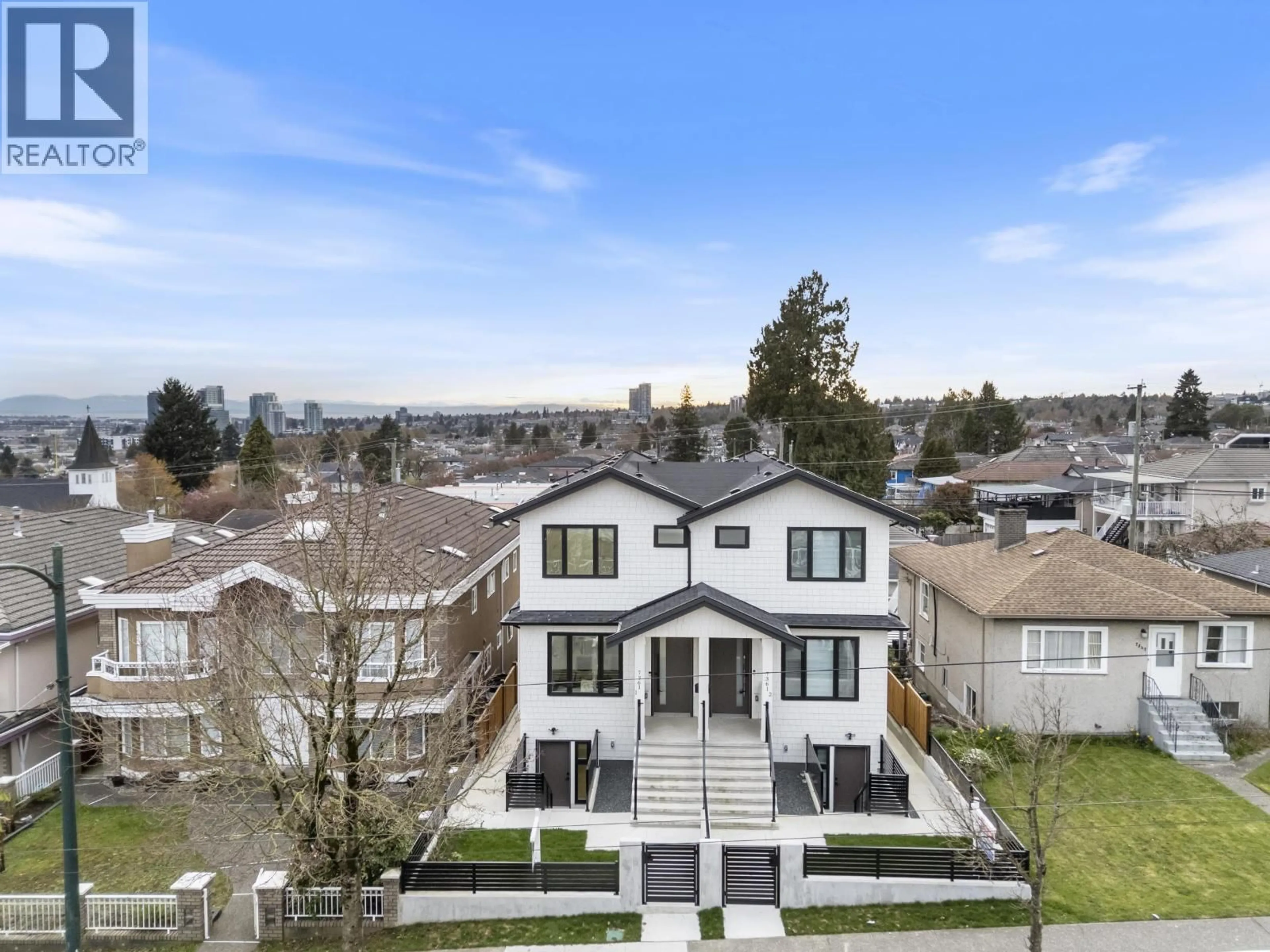 A pic from outside/outdoor area/front of a property/back of a property/a pic from drone, mountain view for 7361 FRASER STREET, Vancouver British Columbia V5X3W1