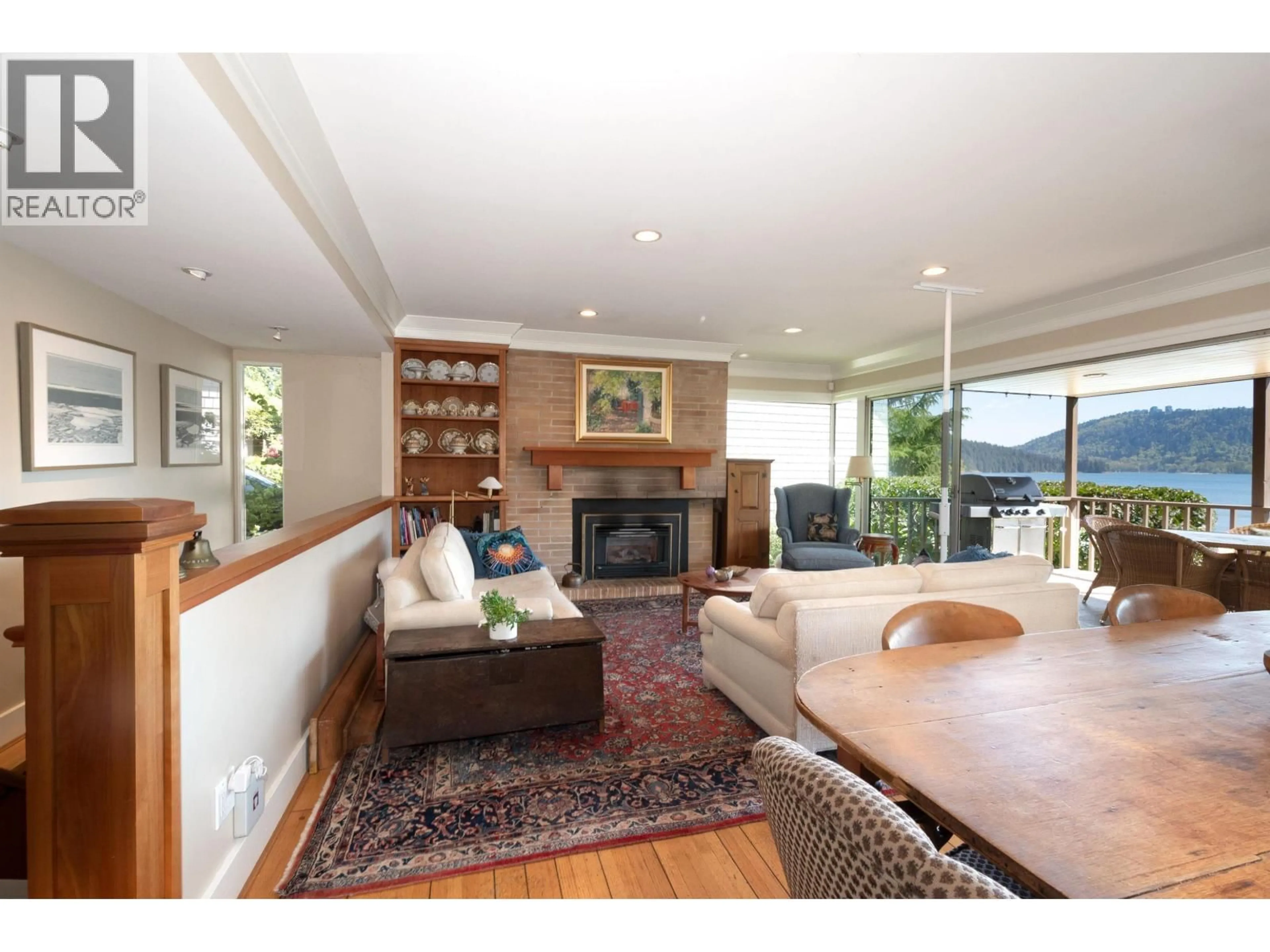 Living room with furniture, wood/laminate floor for 4455 HARRIS PLACE, North Vancouver British Columbia V7G1E9