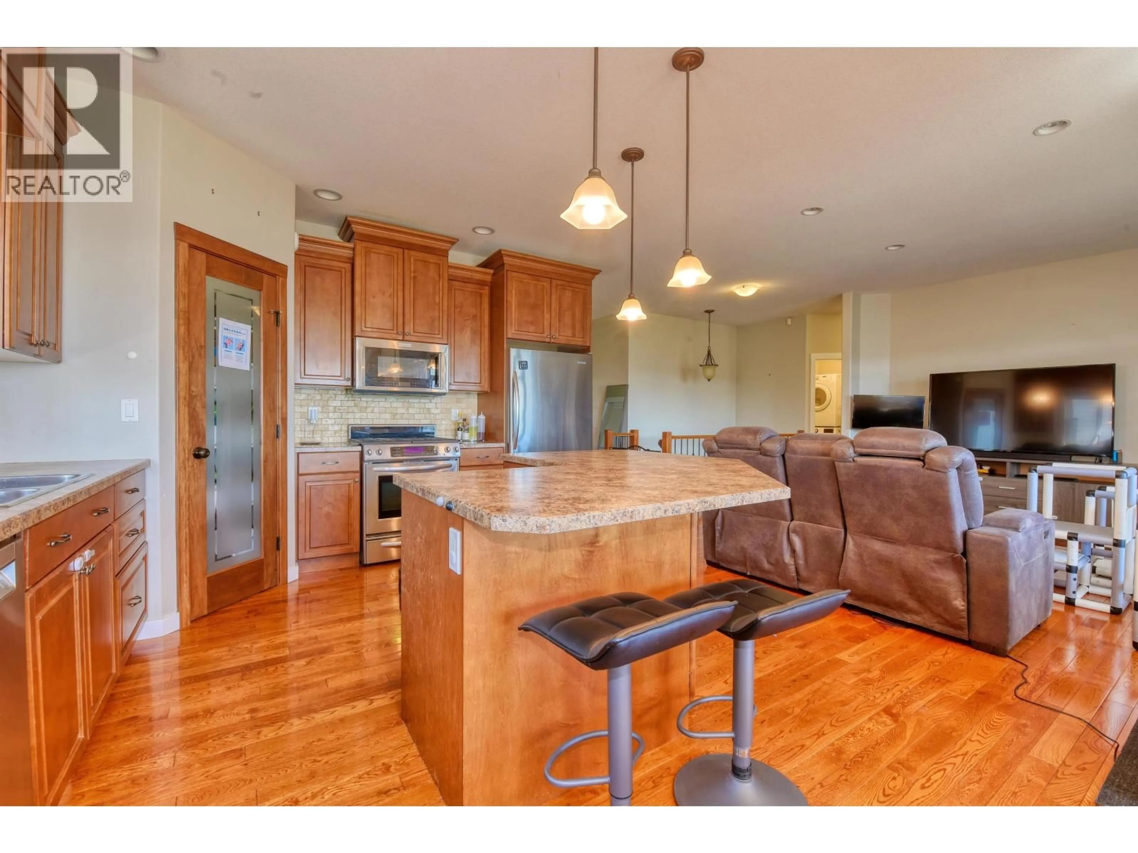 Open concept kitchen, wood/laminate floor for 324 MANDARINO PLACE, Williams Lake British Columbia V2G5J1