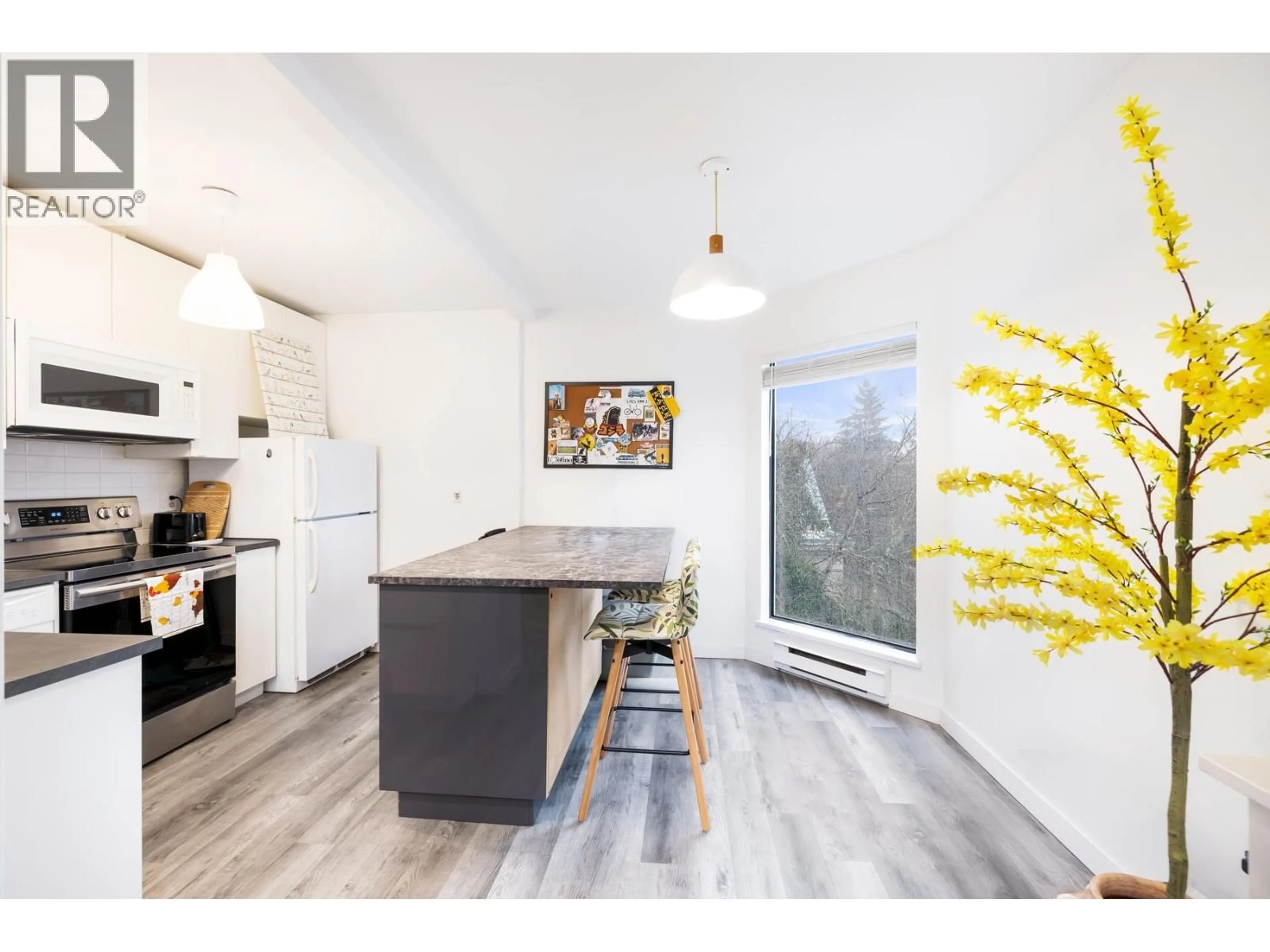 Open concept kitchen, wood/laminate floor for 408 - 340 GINGER DRIVE, New Westminster British Columbia V3L5L7