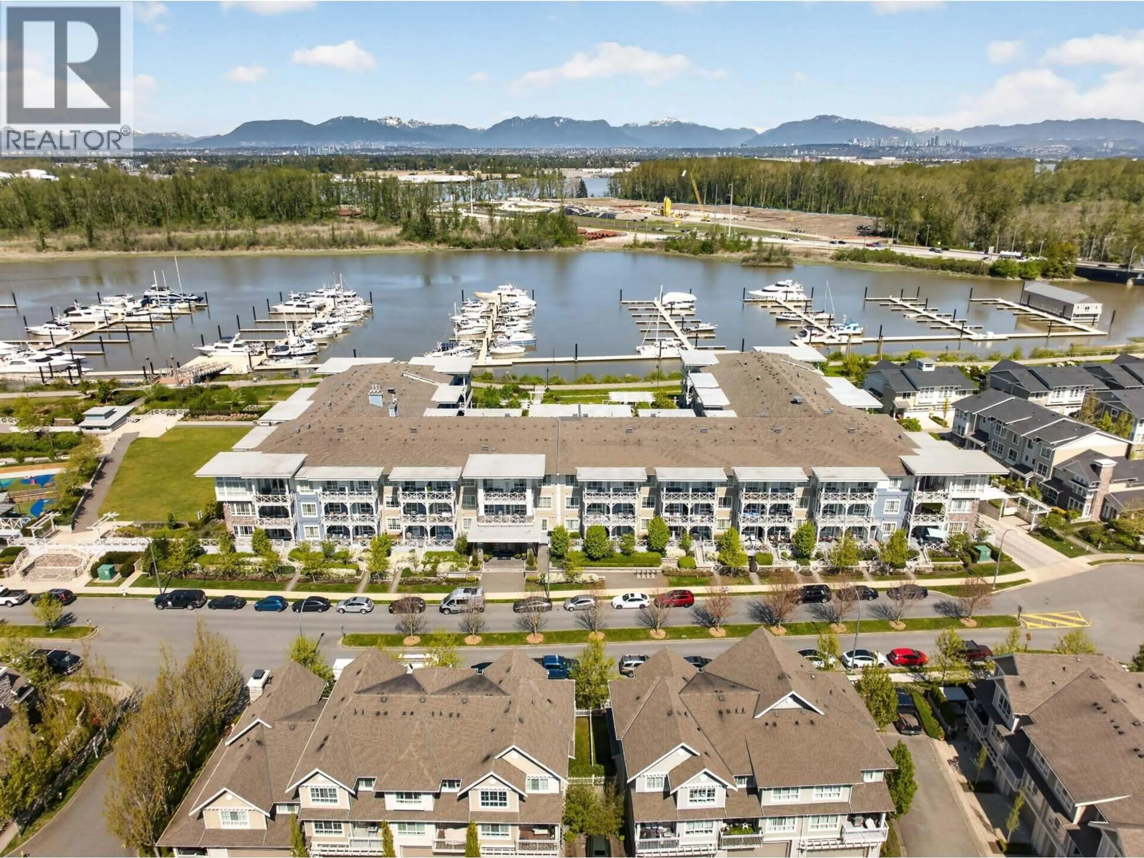 A pic from outside/outdoor area/front of a property/back of a property/a pic from drone, water/lake/river/ocean view for 206 - 5535 ADMIRAL WAY, Delta British Columbia V4K0E3