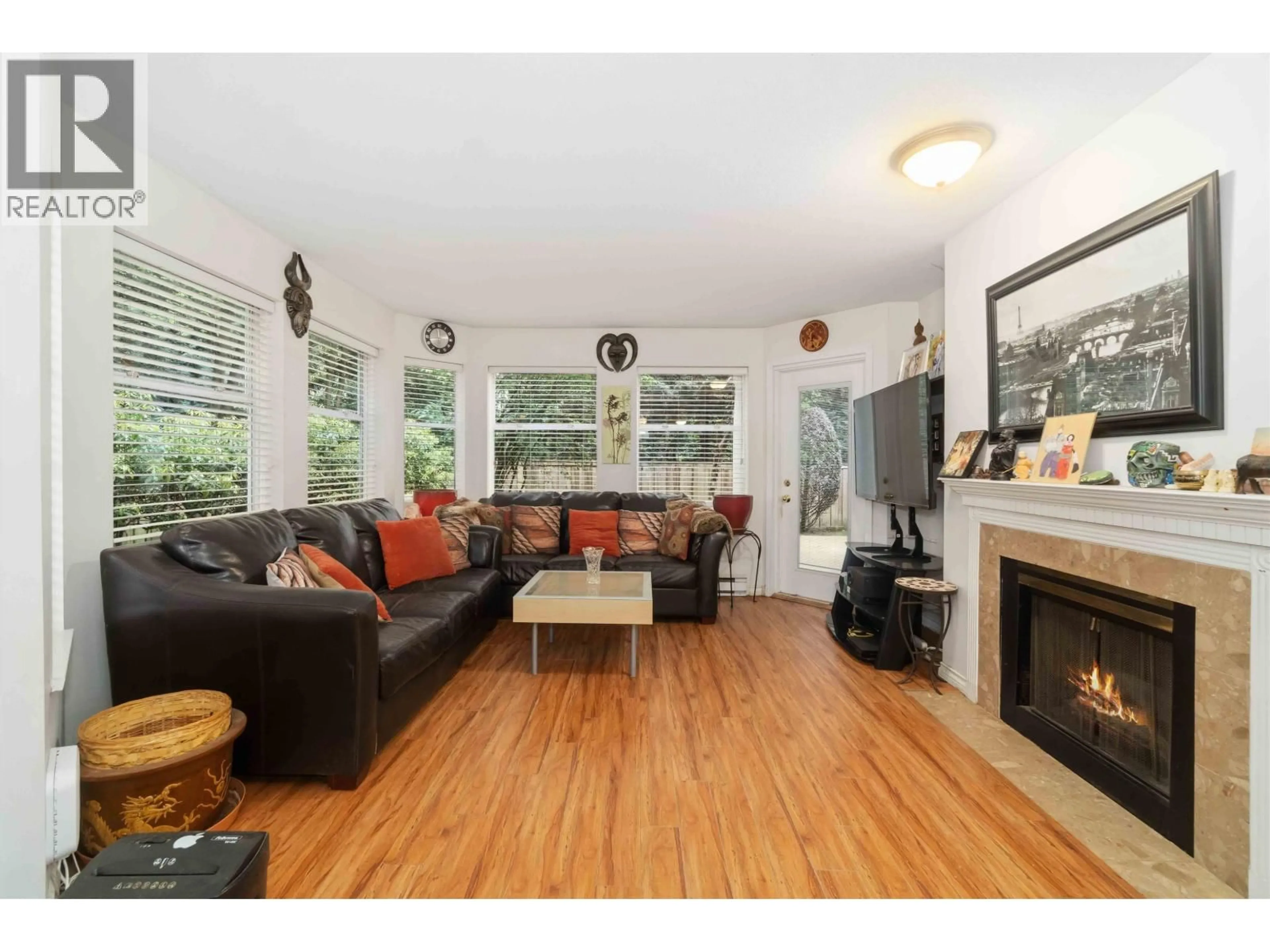 Living room with furniture, wood/laminate floor for 108 - 6860 RUMBLE STREET, Burnaby British Columbia V5E1A8