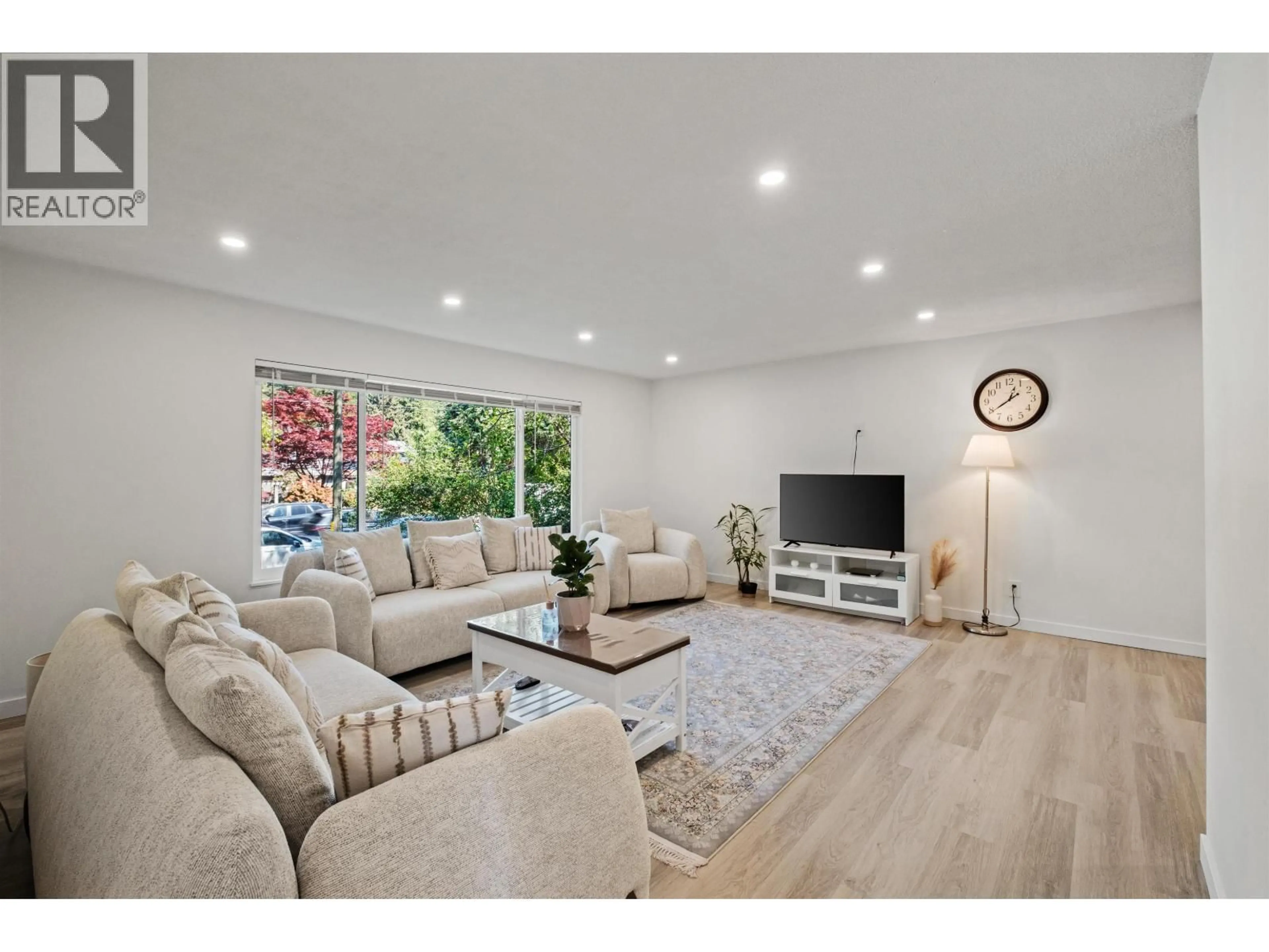 Living room with furniture, wood/laminate floor for 1344 PRAIRIE AVENUE, Port Coquitlam British Columbia V3B1T1